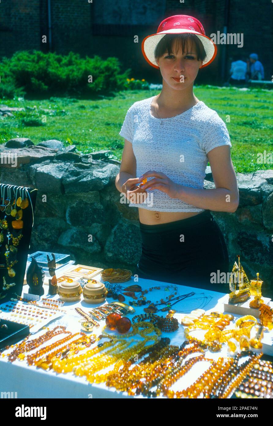 Young woman selling amber jewellery on a summer day in Riga, Latvia Stock Photo
