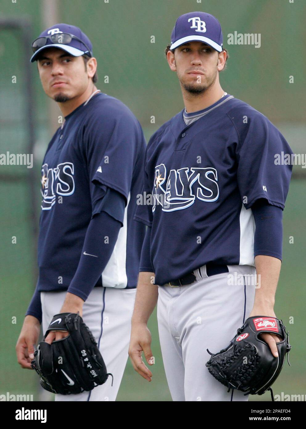 Tampa Bay Rays pitchers Matt Garza, left, and James Shields watch a fielding drill at baseball