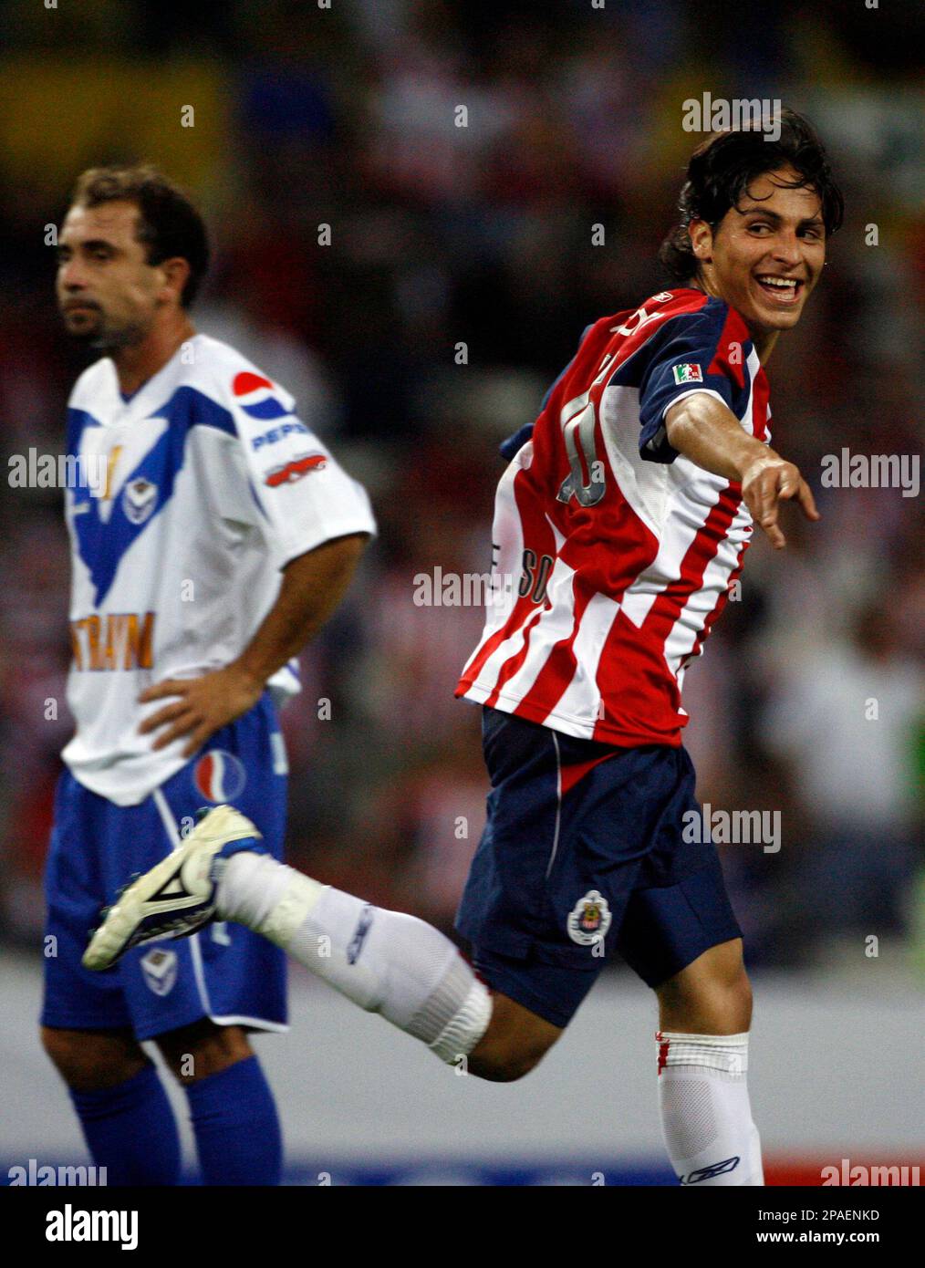 Mexico's Chivas' Edgar Solis, right, celebrates after scoring as
