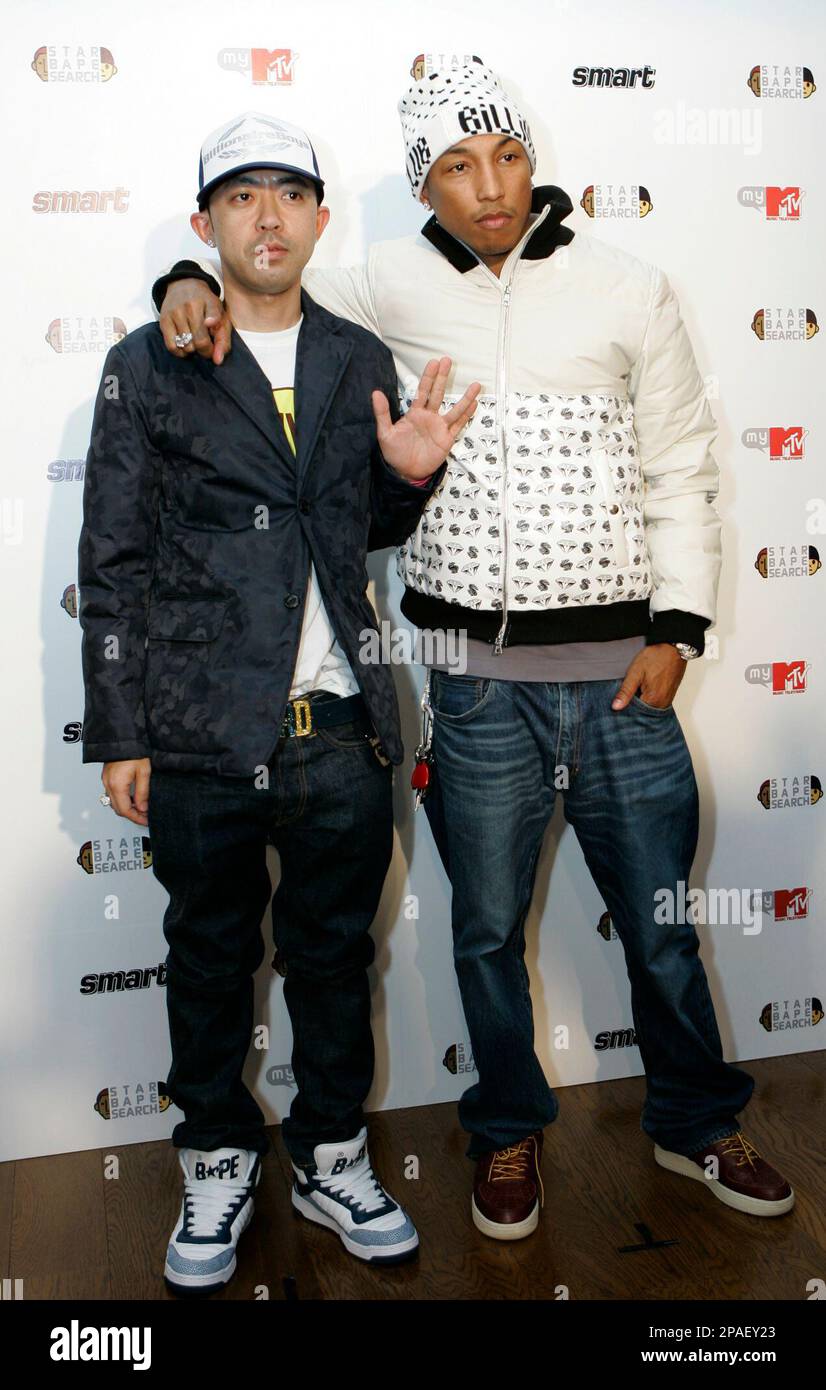 Hip-pop/R&B star Pharrell Williams of the Neptunes, right, and A Bathing  Ape producer Nigo pose for photographers at a press conference to launch  their Star Bape Search audition to look for new