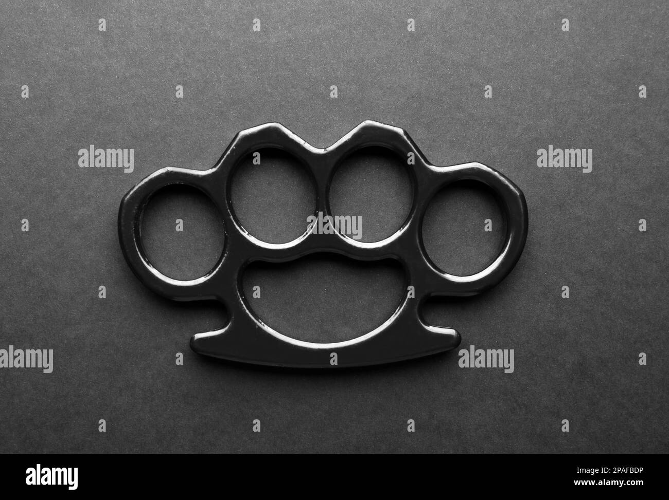 Premium Photo  Black brass knuckles isolated on a white surface