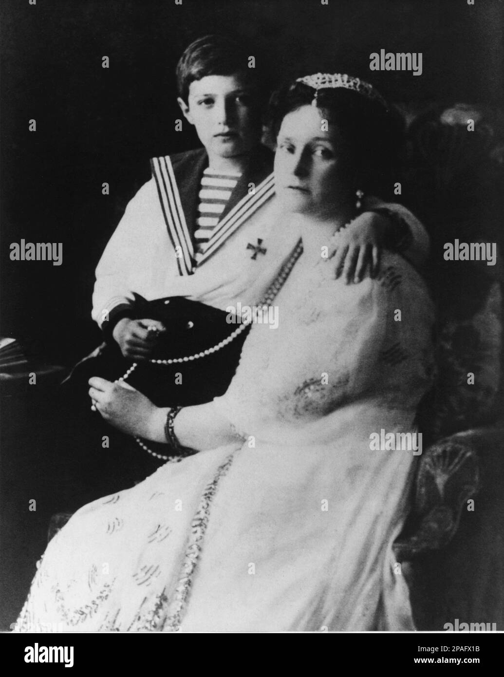 The russian crownprince Grand Duke Tsarevich ALEXEI Nikolaevich ROMANOV (1904 - 1918 ) with mother ALEXANDRA , born Princess Alix of Hesse and by Rhine ( 1872 - 1918 ).  The the youngest child and the only son of Tsar Nicholas II of Russia and Alexandra Fyodorovna .  His mother's reliance on the starets Grigori Rasputin to treat Alexei's haemophilia helped bring about the end of Imperial Russia. His murder following the Russian Revolution of 1917 resulted in his canonization as a passion bearer of the Russian Orthodox Church. He was two weeks shy of his fourteenth birthday when he was murdered Stock Photo