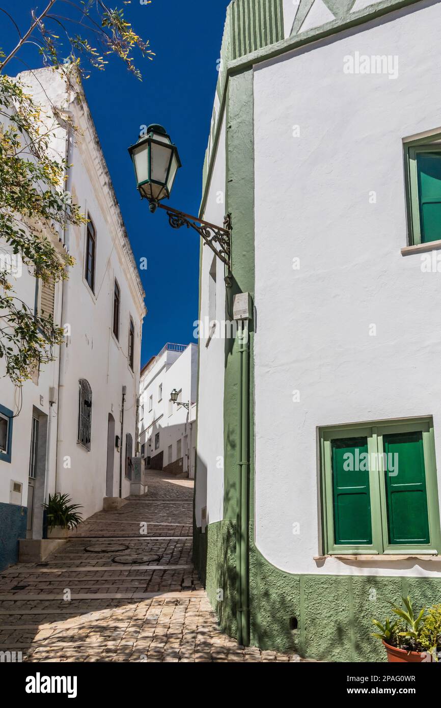 Narrow, steep street, Albufeira old town, Algarve, Portugal Stock Photo