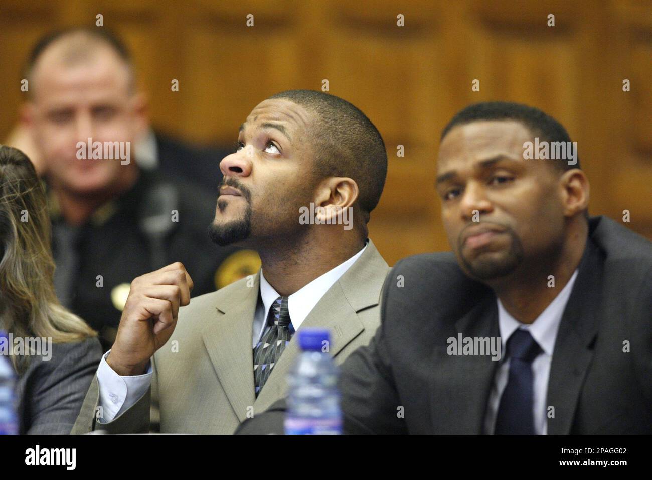 Former Canton police officer Bobby Cutts Jr., left, looks up after ...