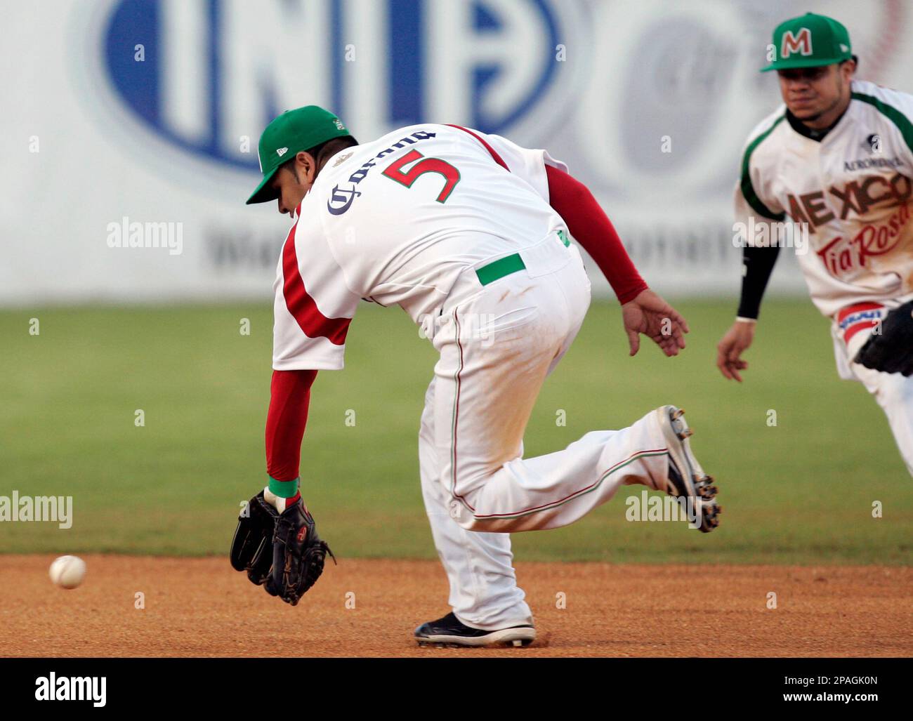 Carlos Valencia, left, and Alfredo Amezaga of Mexico's Yaquis miss a