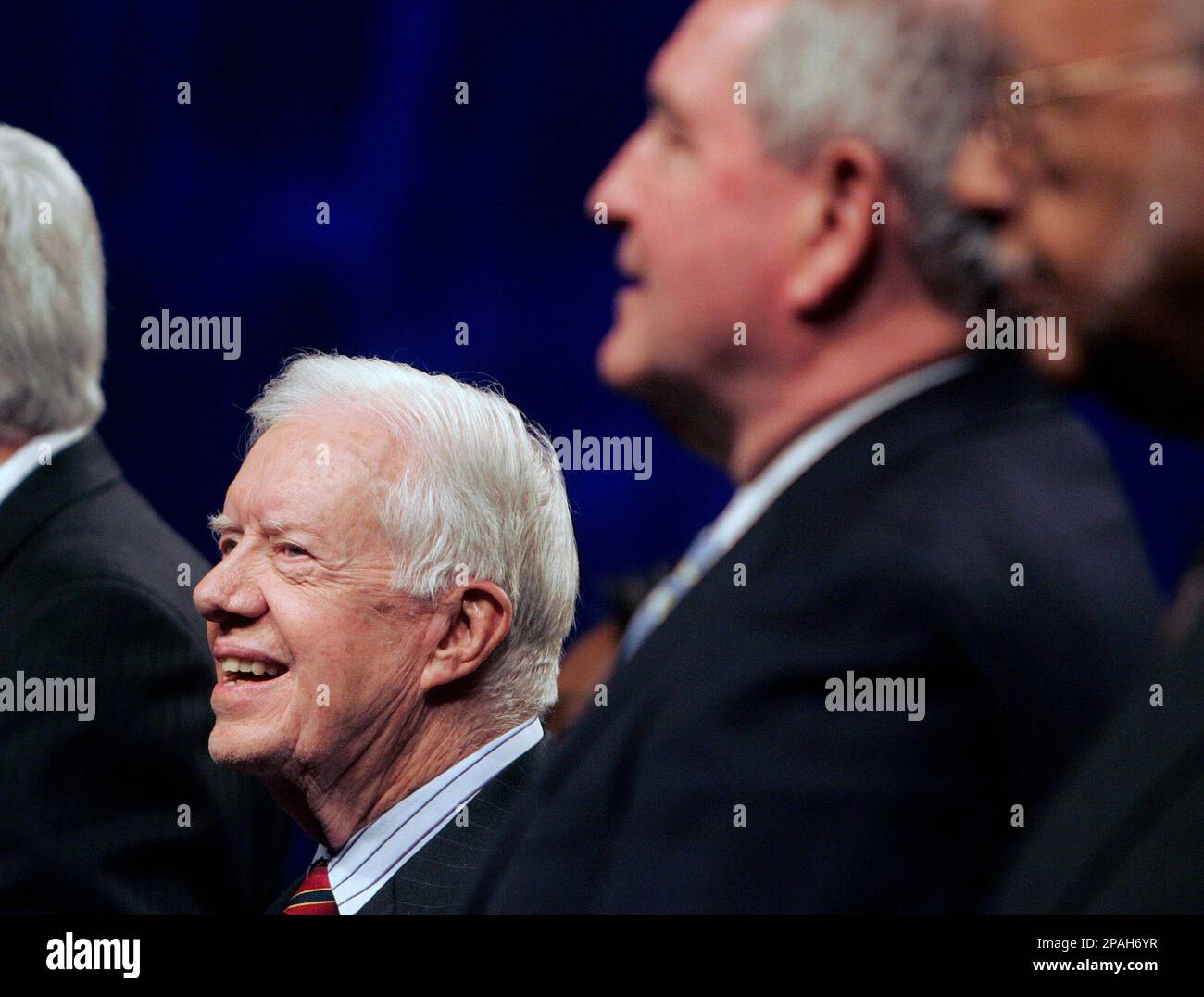 Former President Jimmy Carter, left, and Georgia Gov. Sonny Perdue sing  during the opening session of the New Baptist Covenant Wednesday, Jan. 30,  2008 in Atlanta. (AP Photo/John Bazemore Stock Photo - Alamy