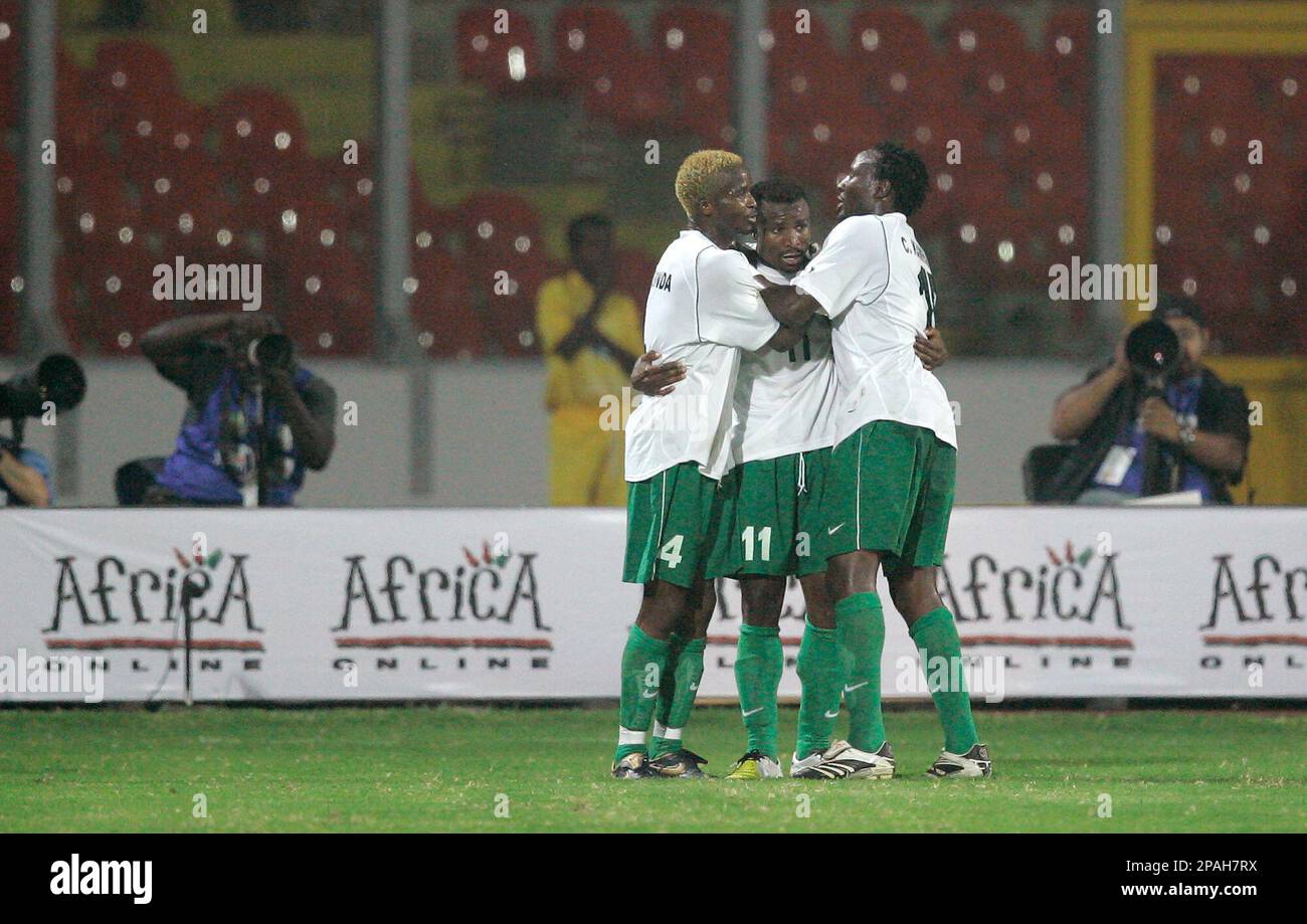 Zambia's Christopher Katongo is hugged by teammates Joseph Musonda