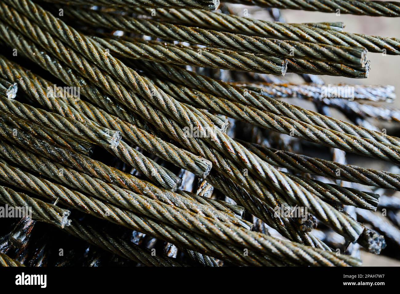 Ends of twisted rope metal wires stacked in warehouse Stock Photo Alamy