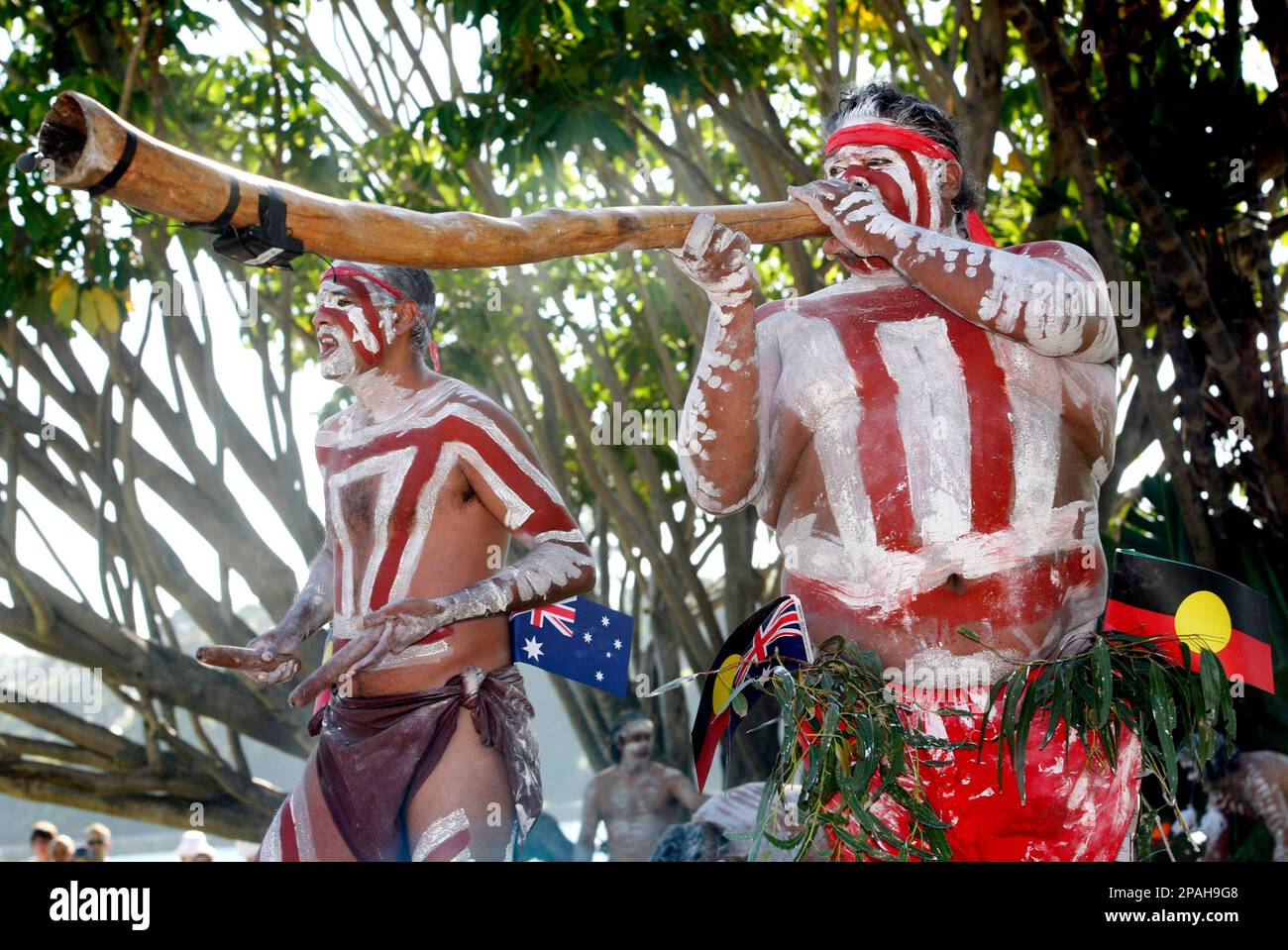 **FILE* Aboriginal performers play traditional didgeridoo instruments and clap sticks during the