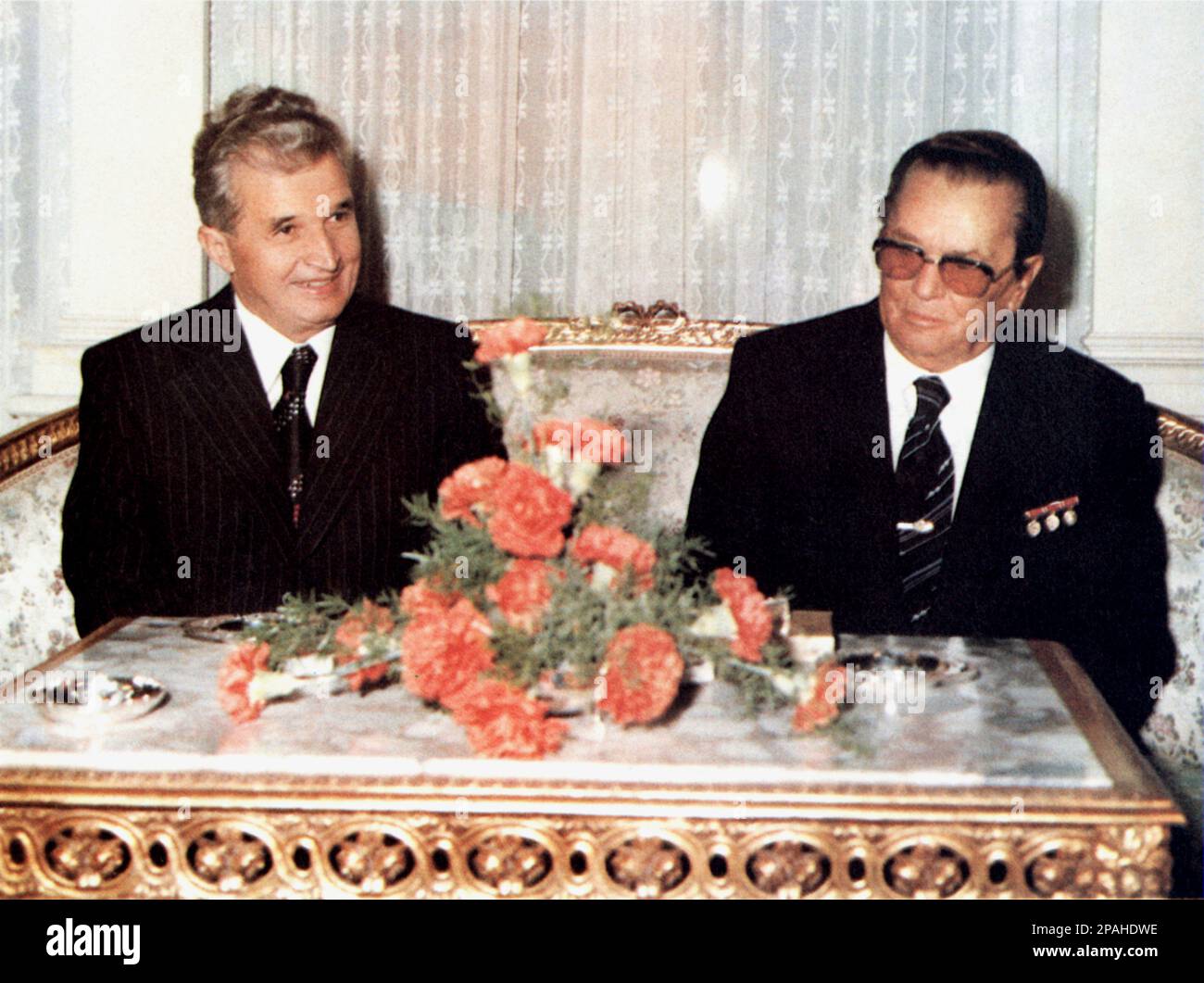 The Romania politician  and dictator NICOLAE CEAUSESCU ( January 26, 1918 – December 25, 1989 ) with JOSIP BROZ TITO ( 1892 - 1990 ) , he leader of the Socialist Federal Republic of Yugoslavia from 1945 until his death . Ceausescu was the leader of Romania from 1965 until December 1989, when a revolution and coup removed him from power. The revolutionaries held a two hour trial and sentenced him to death for crimes against the state, genocide, and ' undermining the national economy.' The hasty trial has been criticized as a kangaroo court  His subsequent execution marked the final act of the R Stock Photo