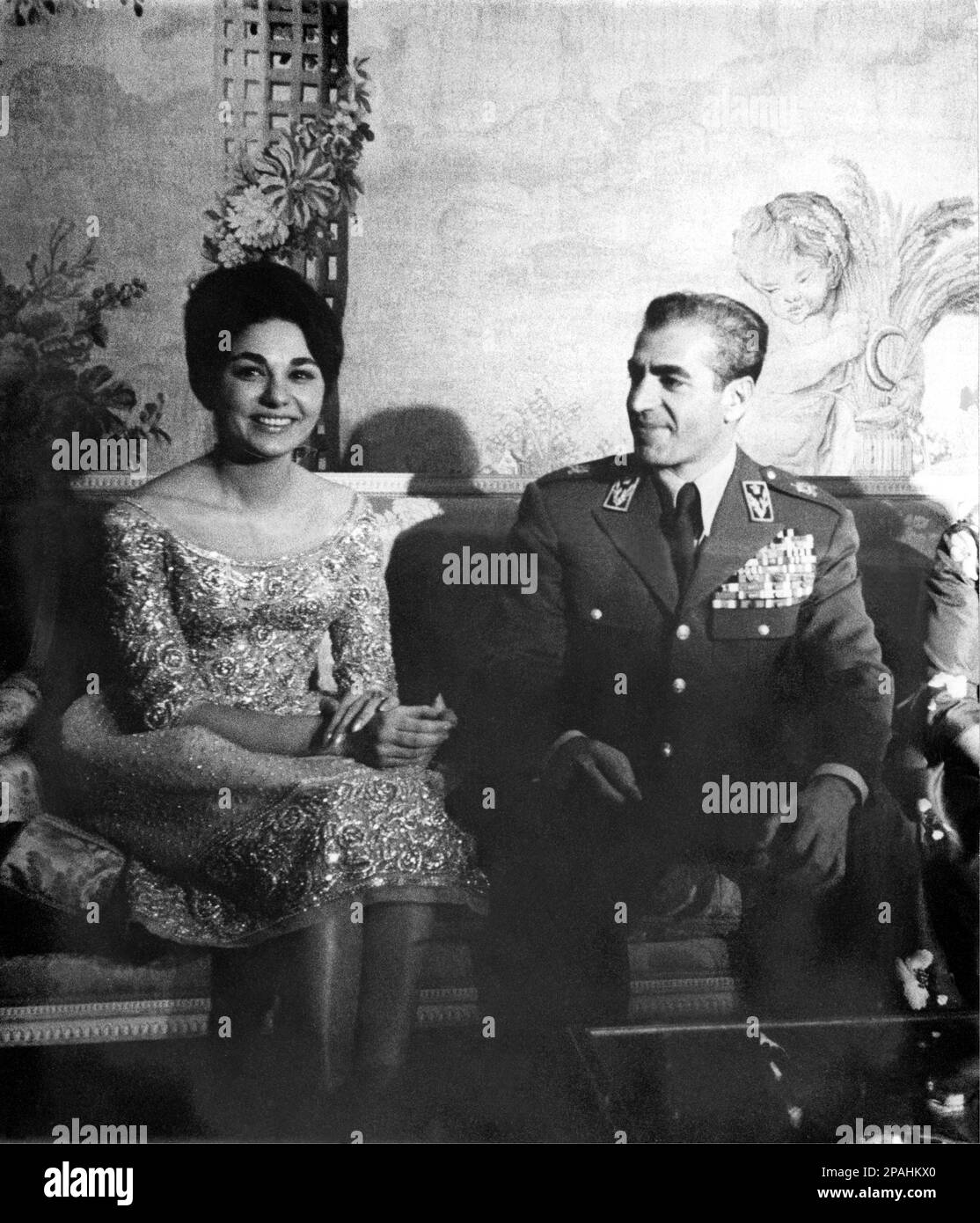 1959 , Teheran , Iran : The Shah of  Iran Mohammad REZA PAHLAVI ( 1919, Tehran – 1980, Cairo ) with 3nd wife FARAH DIBA ( born October 14, 1938 ) . She was born in Tehran as Farah Diba, the only child of Sohrab Diba and his wife, Farideh Ghotbi. Her mother was originally from Gilan and her father, who died when she was a child, was an officer in the Imperial Iranian Army whose family was originally from Iranian Azarbaijan . She studied at the French school in Tehran and École Spéciale d'Architecture in Paris, where she was a student of Albert Besson. While a student, she was introduced to the Stock Photo
