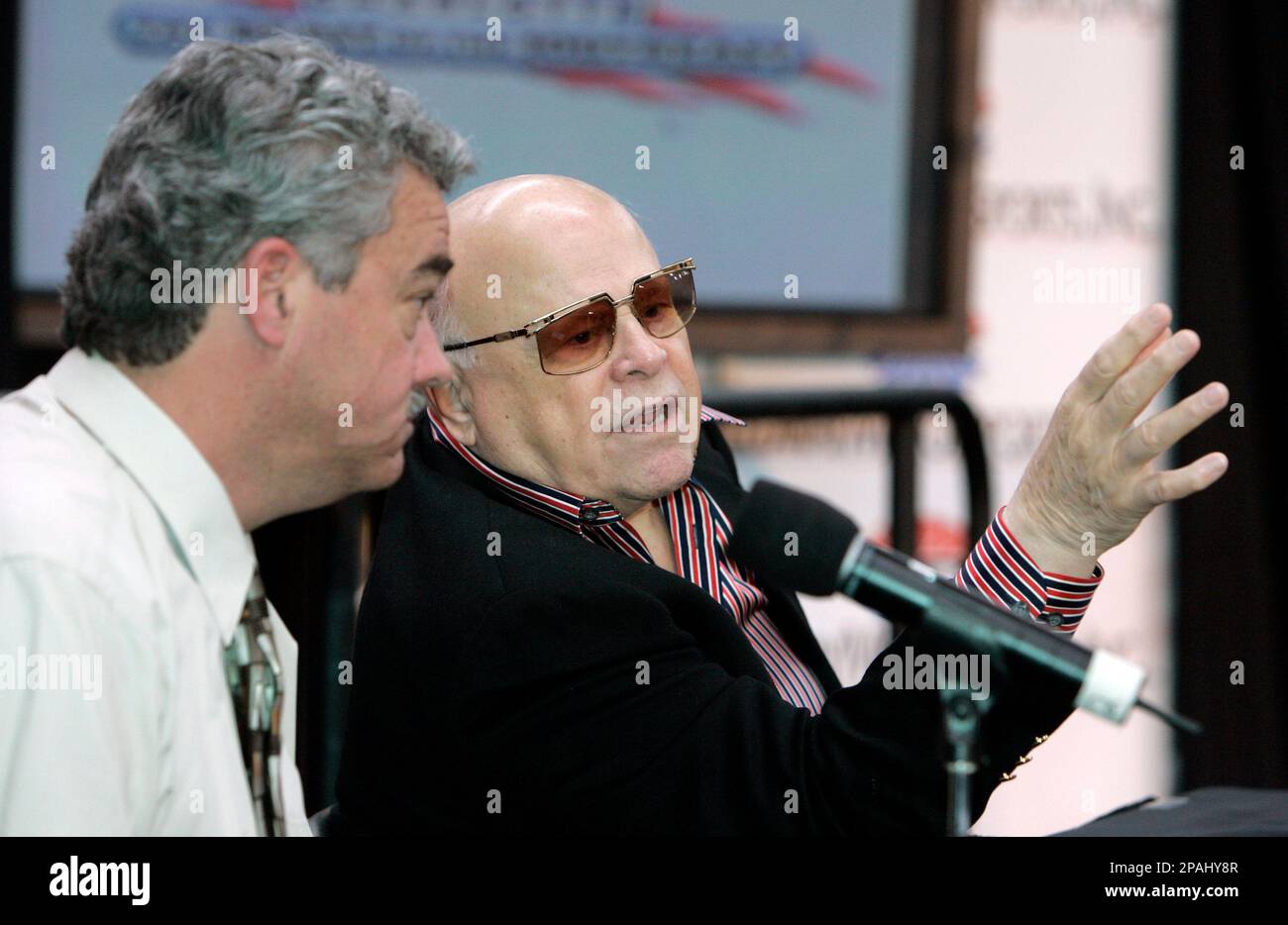 Lowe s Motor Speedway owner Bruton Smith right talks with NHRA