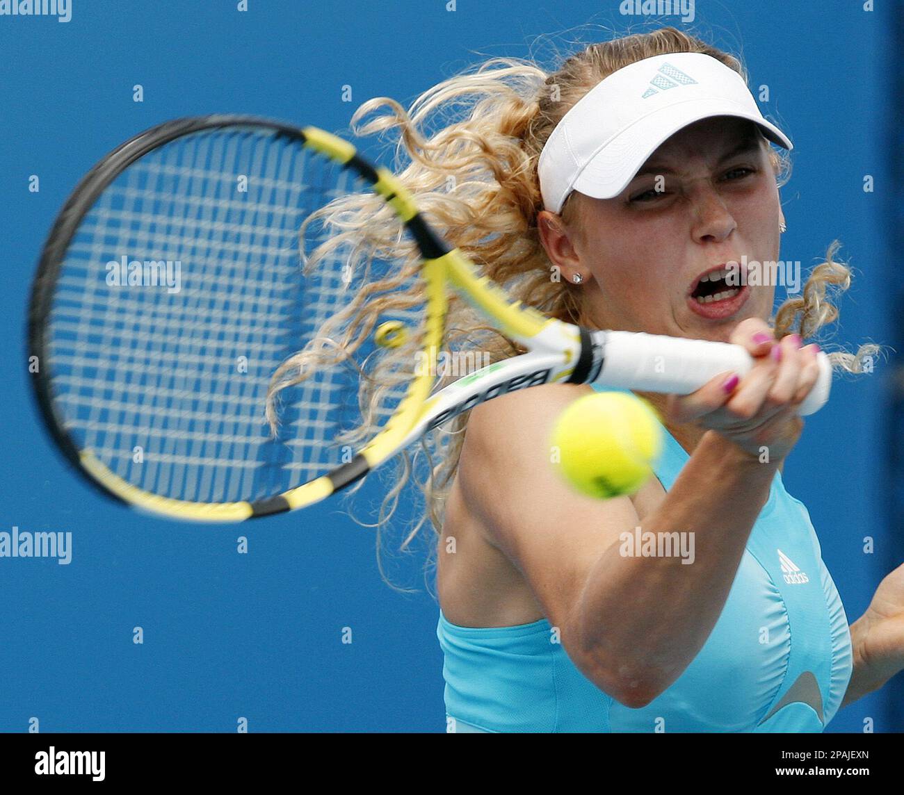 Denmark's Caroline Wozniacki returns to Germany's Sabine Lisicki in