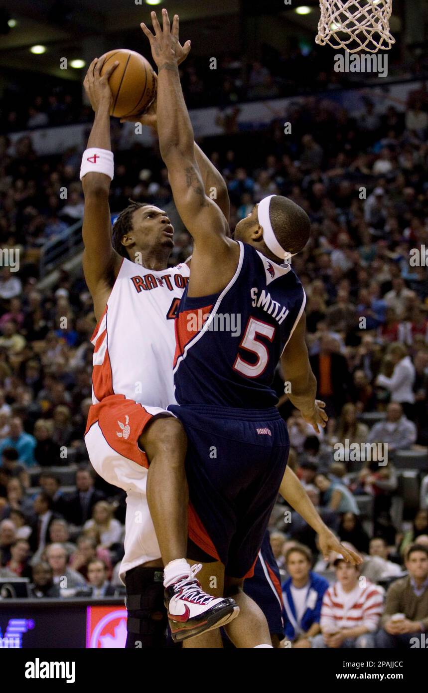 Toronto Raptors' Chris Bosh drives to the net as he is fouled by San  Antonio Spurs' Sean Marks during NBA action in Toronto, Wednesday Feb. 8,  2006. (AP PHOTO/CP, Adrian Wyld Stock