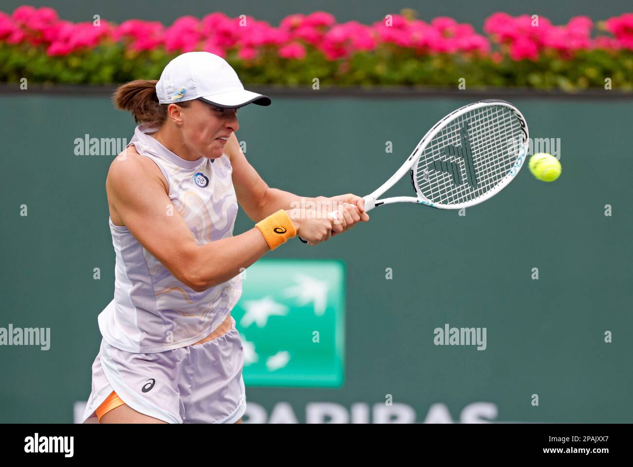 March 11, 2023 Iga Swiatek of Poland returns a shot to Claire Liu during  the 2023 BNP Paribas Open at Indian Wells Tennis Garden in Indian Wells,  California. Mandatory Photo Credit: Charles