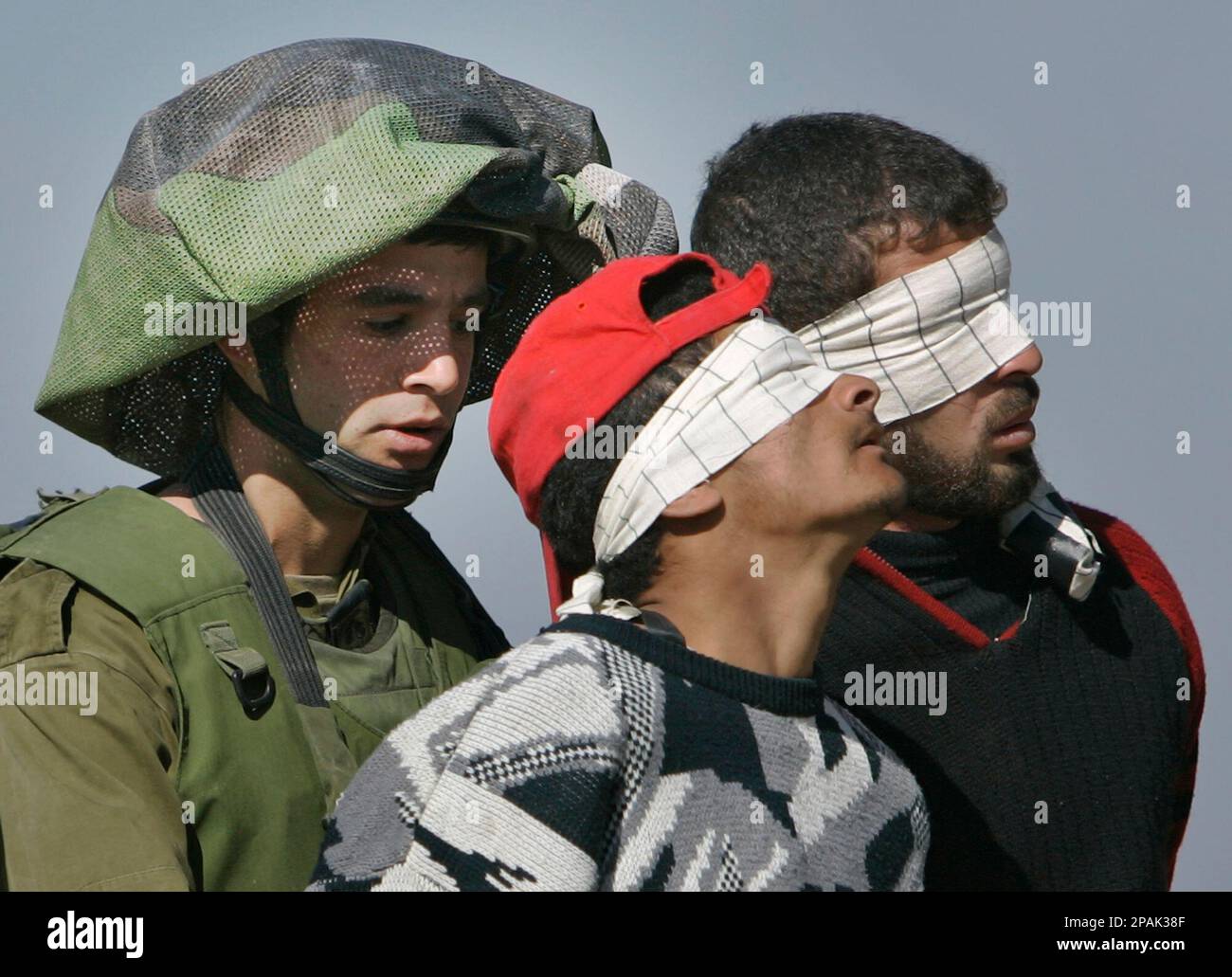 An Israeli Soldier, Left, At The Israel-Gaza Border Walks With Two ...