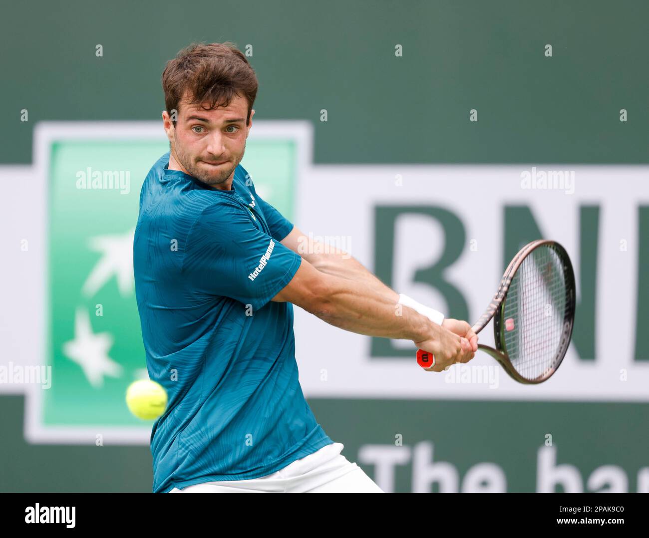 March 11, 2023 Pedro Martinez of Spain returns a shot against Felix Auger-Aliassime of Canada during the 2023 BNP Paribas Open at Indian Wells Tennis Garden in Indian Wells, California