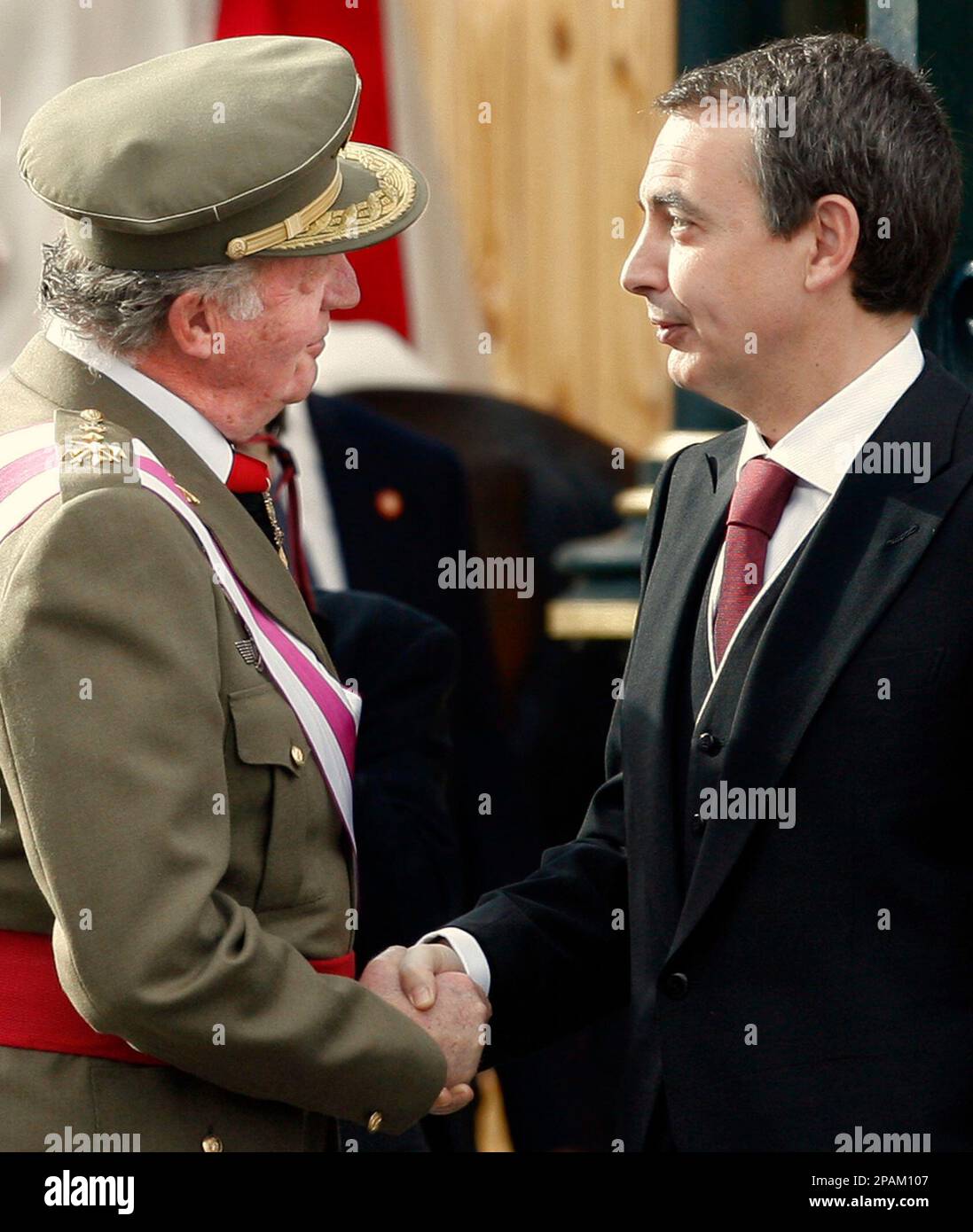 Spanish Head of State, King Juan Carlos, left, shake hands with Spanish Prime Minister Jose Luis