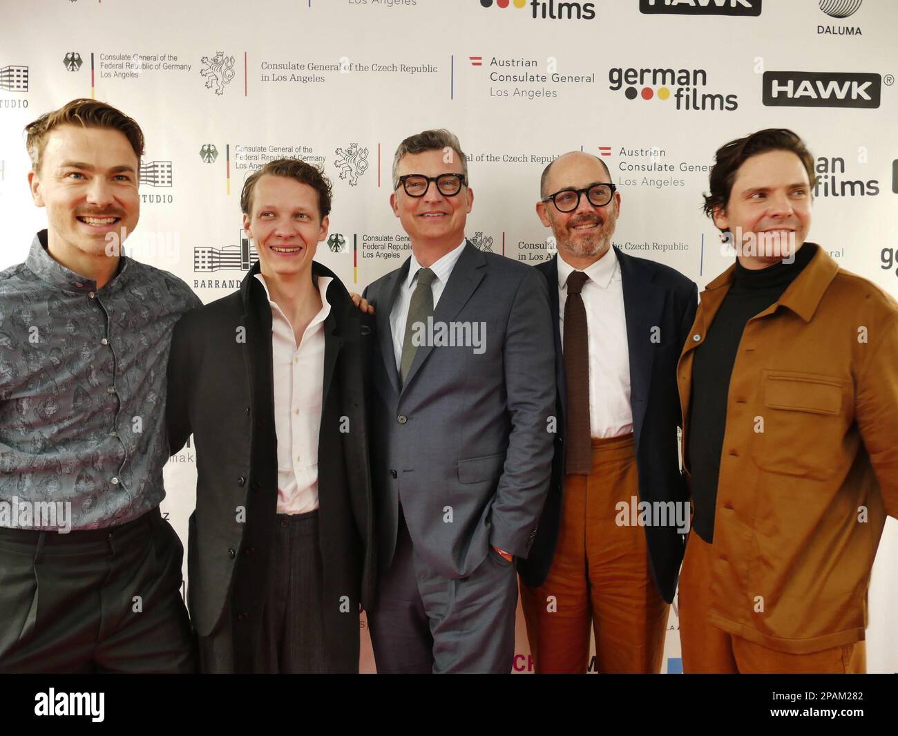 Los Angeles, USA. 11th Mar, 2023. Actor Albrecht Schuch (l-r), actor Felix Kammerer, producer Malte Grunert, director Edward Berger and actor Daniel Brühl stand together at the traditional reception for German Oscar contenders at the historic Villa Aurora in Pacific Palisades. Credit: Barbara Munker/dpa/Alamy Live News Stock Photo