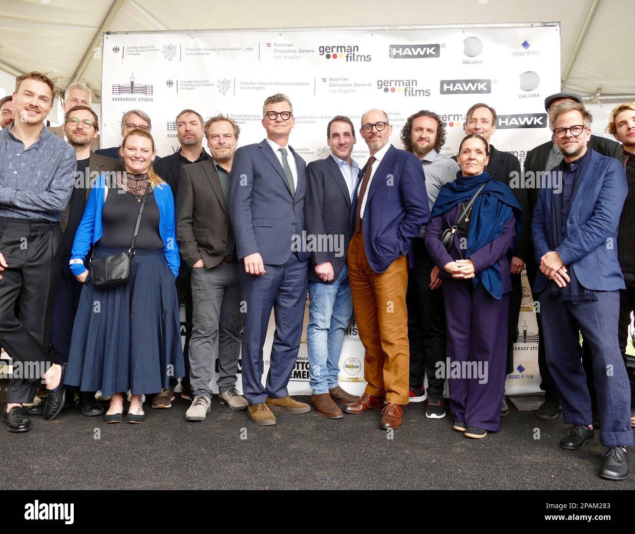 Los Angeles, USA. 11th Mar, 2023. At the 95th Academy Awards nominees from 'Nothing New in the West' stand together for a group photo with director Edward Berger (7th from right) on a stage at the traditional reception for German Oscar contenders at the historic Villa Aurora in Pacific Palisades. Credit: Barbara Munker/dpa/Alamy Live News Stock Photo