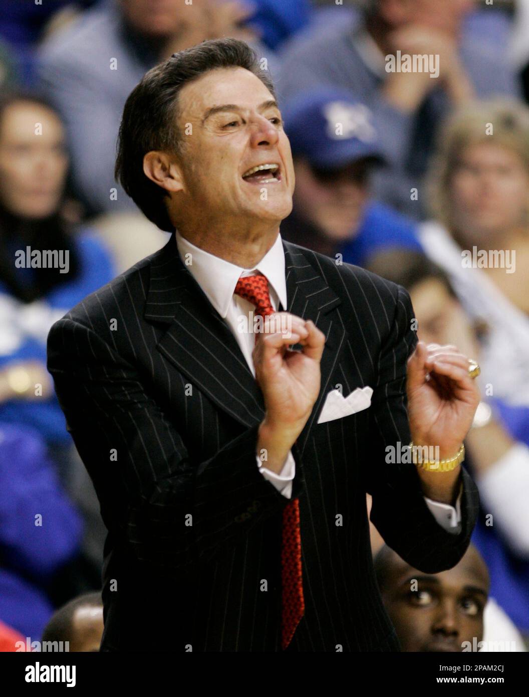 Louisville coach Rick Pitino urges his players on during the second