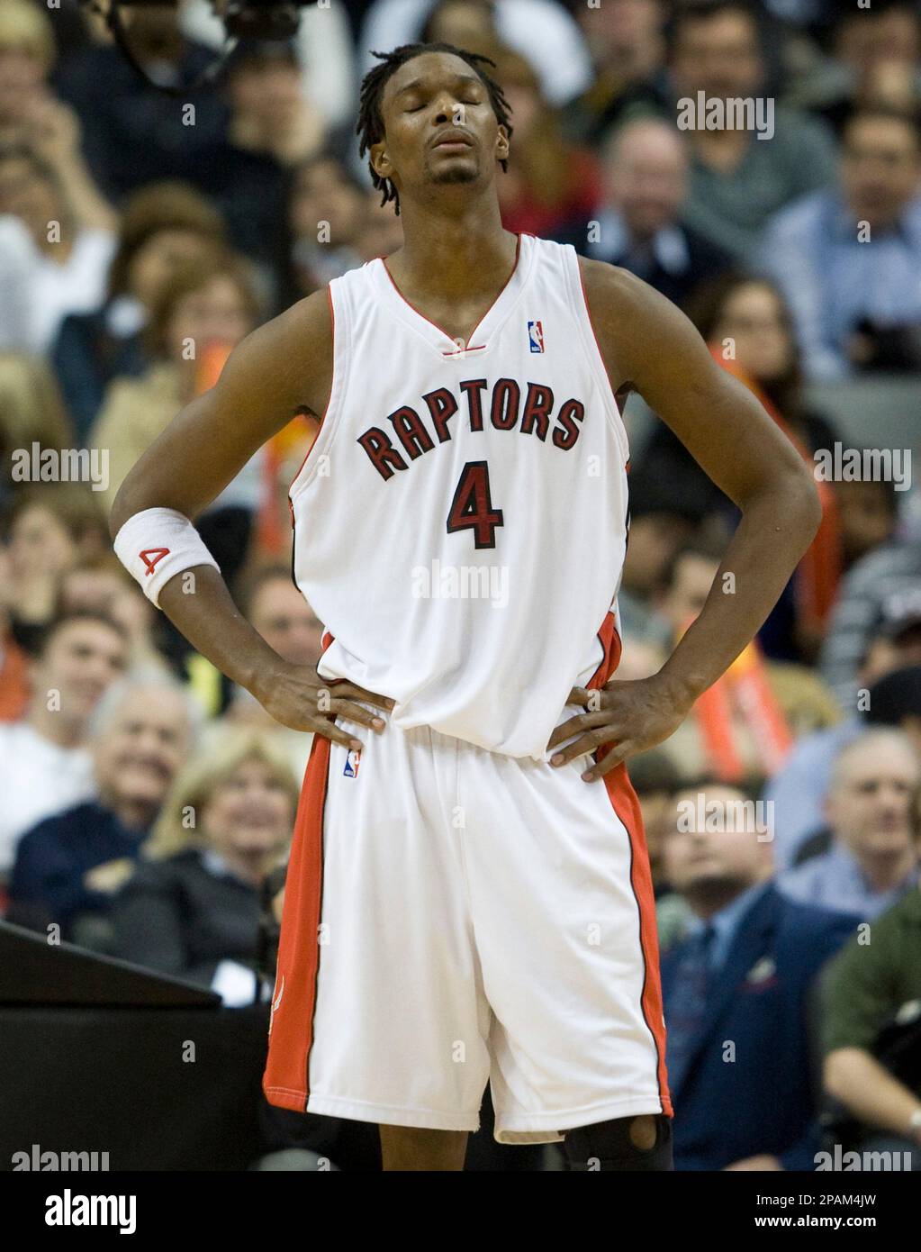 Toronto Raptors' Chris Bosh reacts during the fourth quarter of