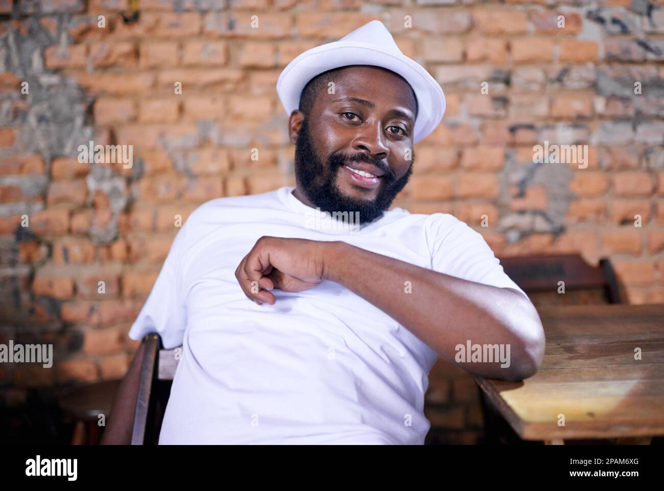 Looking relaxed. a ethnic man relaxing indoors. Stock Photo