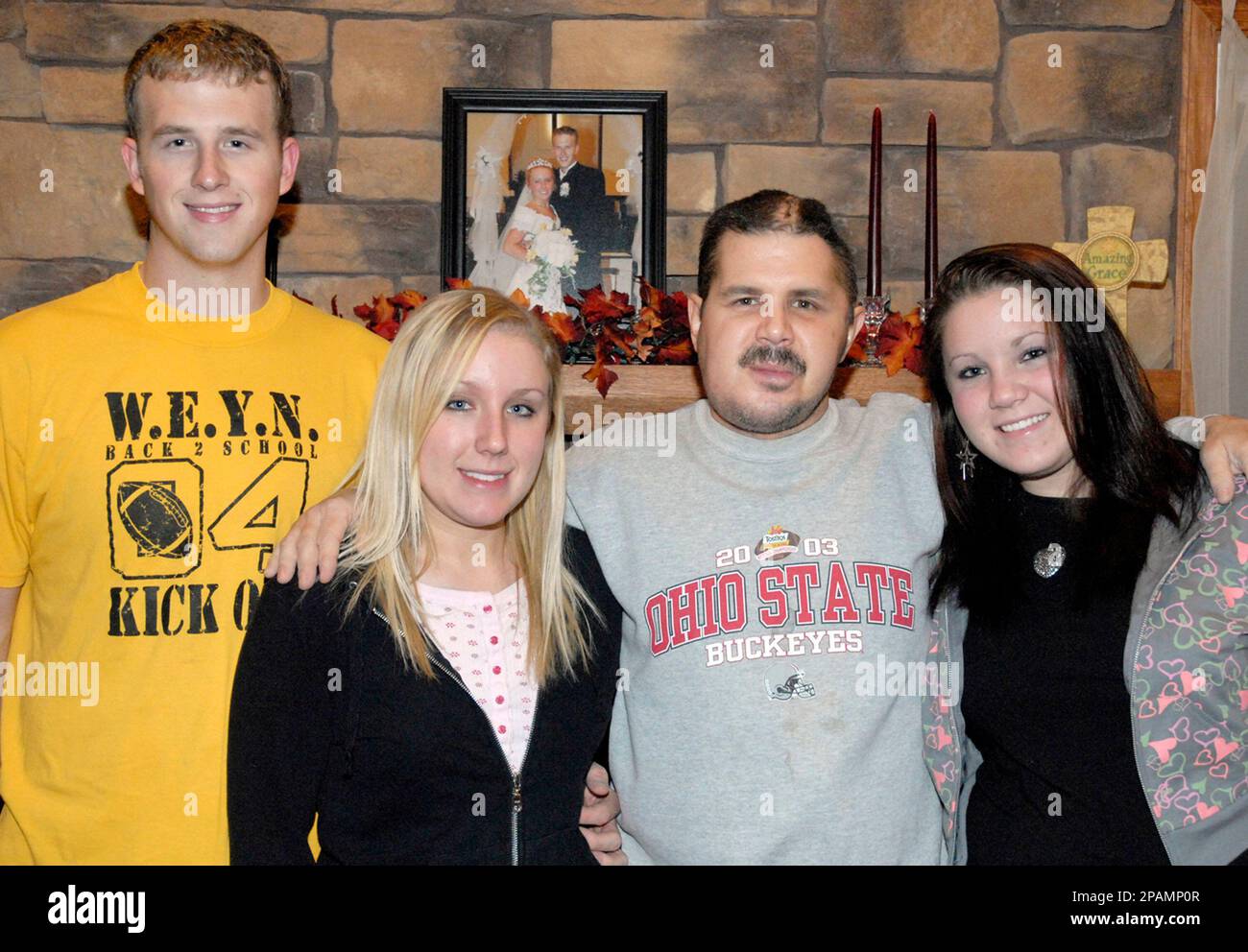** FILE ** In this Nov. 24, 2007, file photo, the Rev. Mark Petric, second from right, is shown in Brighton, Ohio with his son-in-law Andy Archer, left, and daughters Heidi Archer and Holly Petric, right. Petric. Lorain County Common Pleas Judge James Burge granted a request by attorneys for Daniel Petric, 16, to grant the boy's father, the Rev. Mark Petric, clergy status at the Lorain County Jail so he can minister to his son. (AP Photo/The Chronicle Telegram, Carl Sullenberger, File) Stock Photo