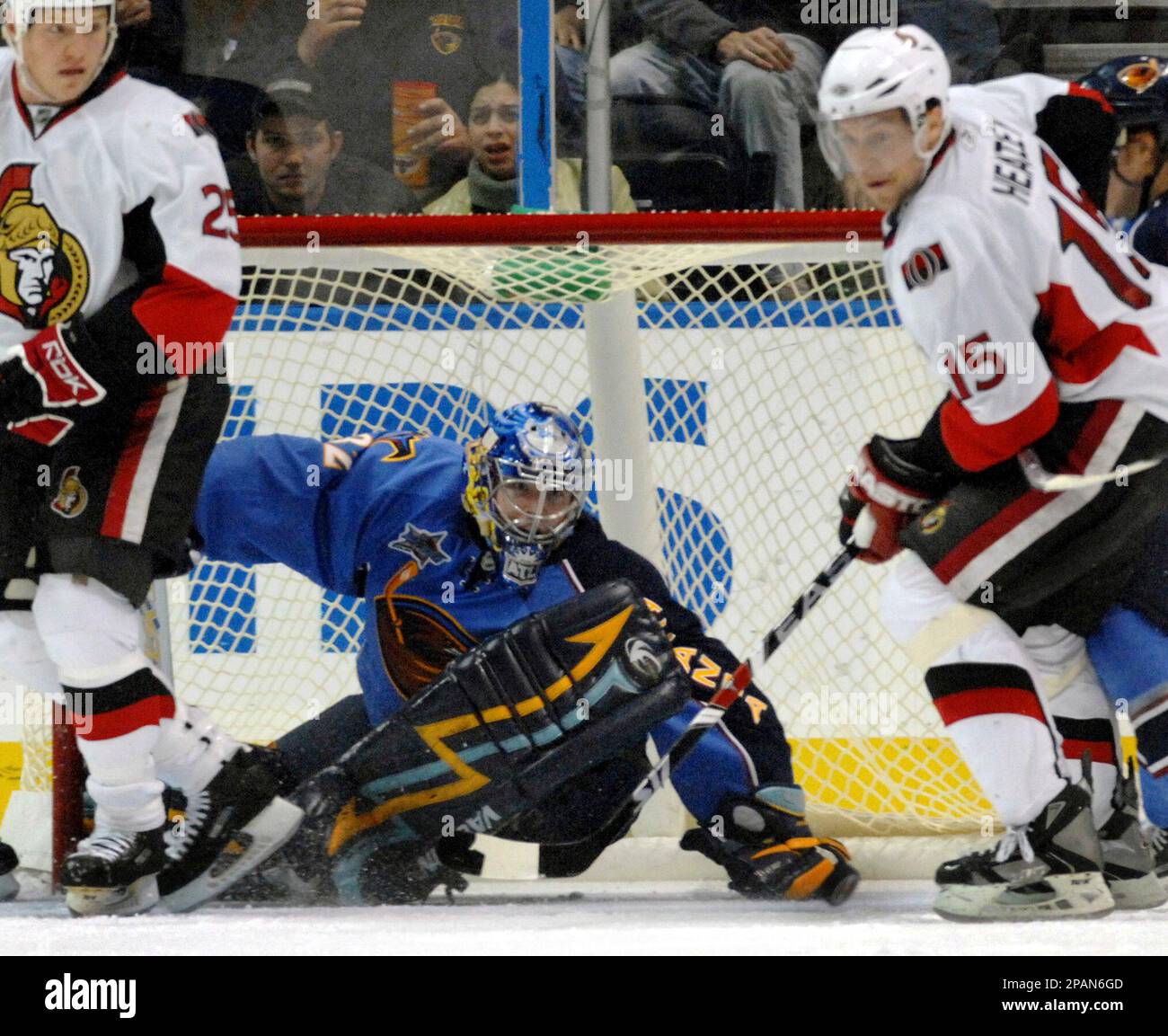 Atlanta Thrashers right wing Dany Heatley, right, hits the puck away from  Pittsburgh Penguins center Mike Eastwood on Friday, April 2, 2004, in  Atlanta. (AP Photo/Matt Roth Stock Photo - Alamy