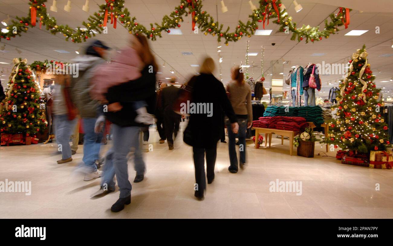 Shoppers return to the Von Maur department store at the Westroads ...