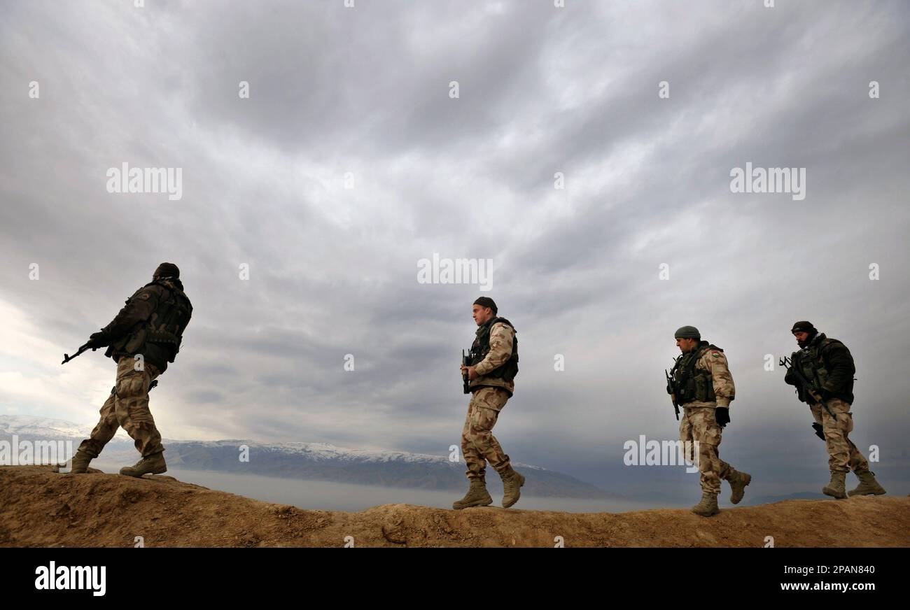 Hungarian soldiers on foot patrol on the hill tops near Pol-e-Khomri,  provincial capital of the Baghlan province, Afghanistan, Thursday, Dec. 20,  2007. The Hungarian Army leads the Provincial Reconstruction Team (PRT) to