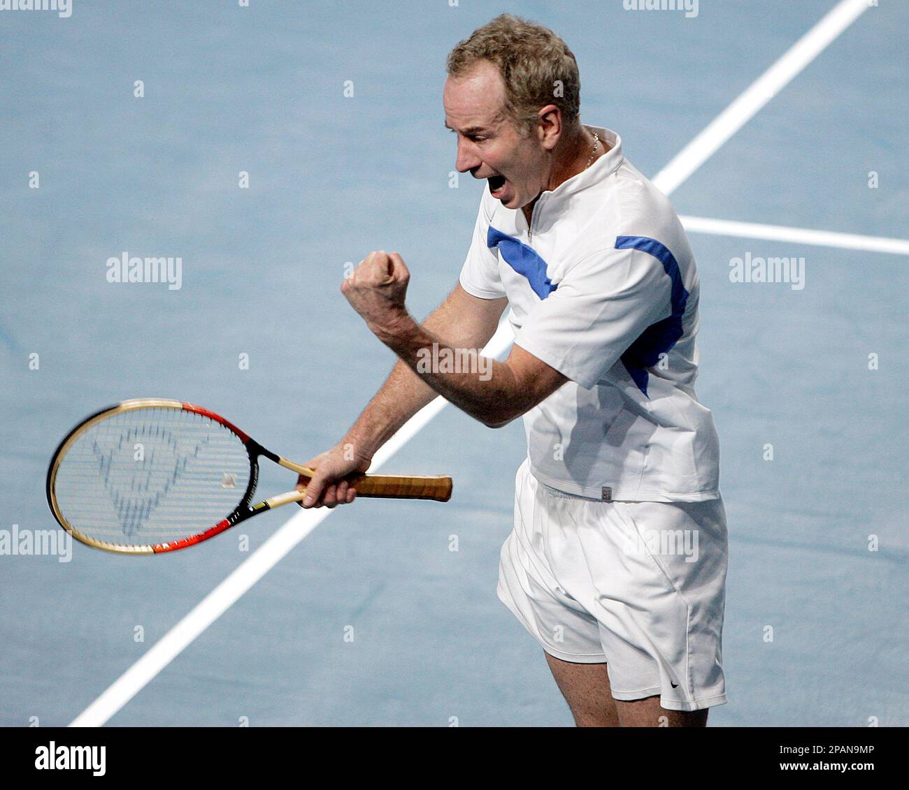 Former tennis pro John McEnroe reacts after winning against Boris Becker at  the Masters of Legends tennis tournament in Duesseldorf, Germany,  Wednesday, Dec. 19, 2007. McEnroe won the one set match in