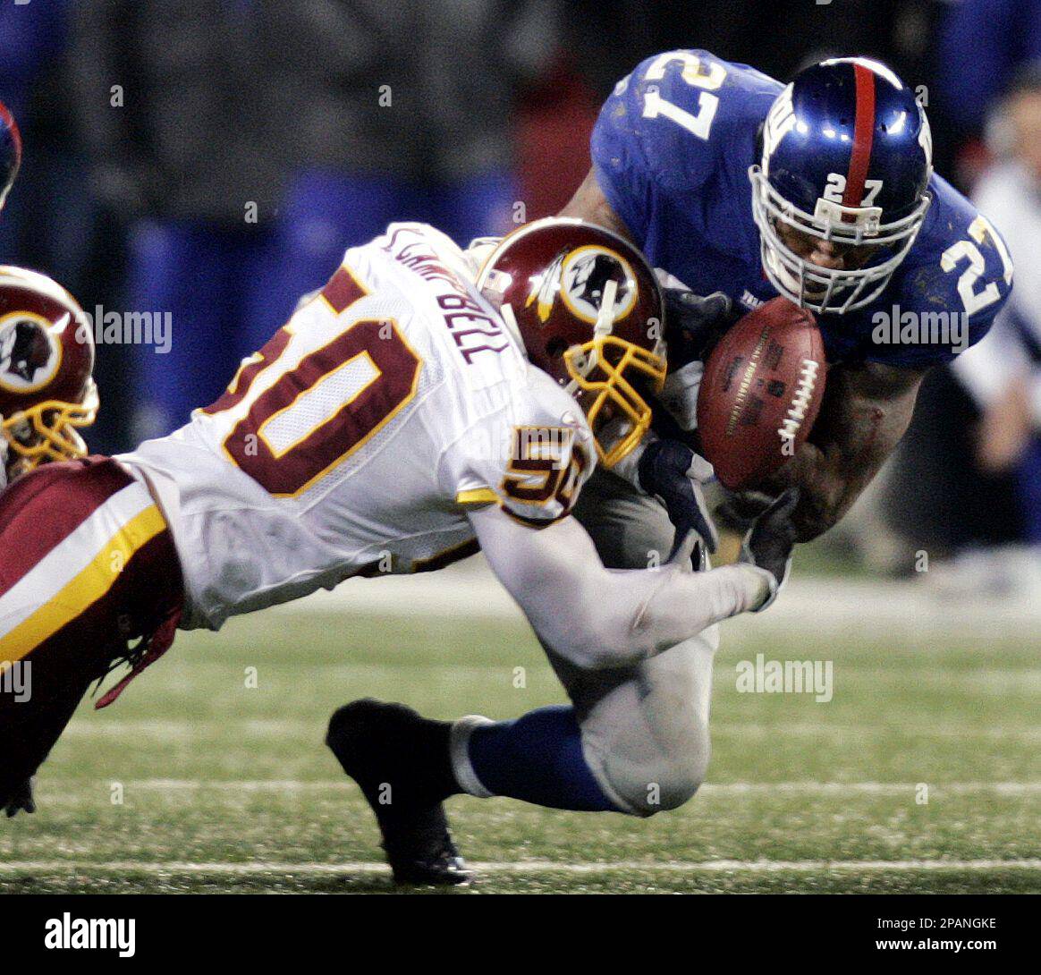 Washington Redskins Khary Campbell (50) reacts after Shaun Suisham (6)  kicks a game winning 46 yard field goal in overtime against the New York  Jets at Giants Stadium in East Rutherford, New