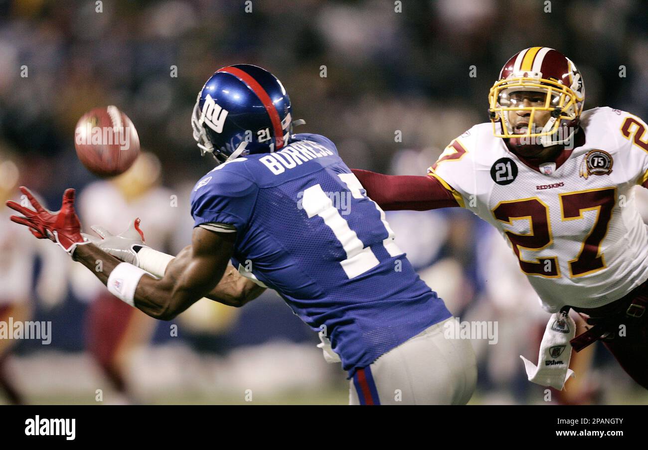 Washington Redskins' Fred Smoot (27) breaks up a pass
