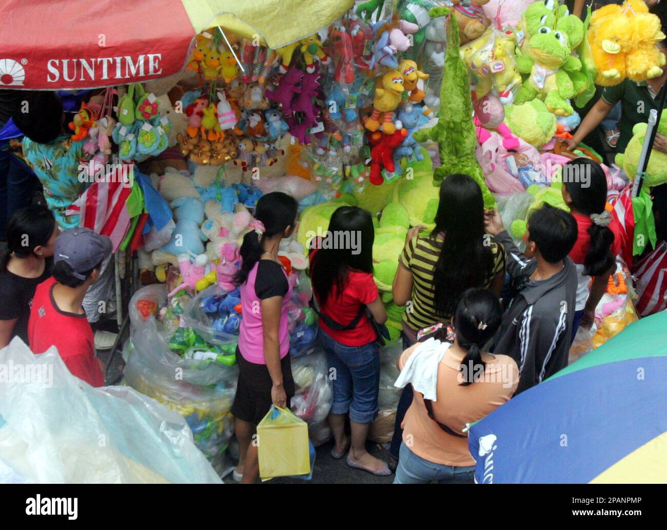 People look at stuffed toys Saturday, Dec. 15, 2007, at Manila's