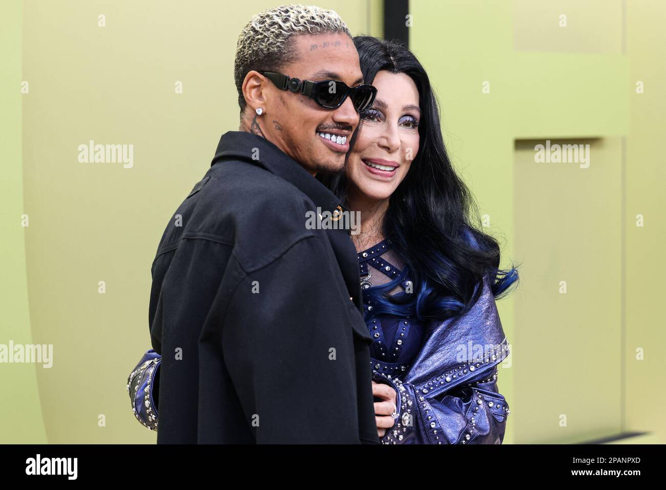 WEST HOLLYWOOD, LOS ANGELES, CALIFORNIA, USA - MARCH 09: American rapper Alexander Edwards and girlfriend/American singer, actress and television personality Cher (Cherilyn Sarkisian) arrive at the Versace Fall/Winter 2023 Fashion Show held at the Pacific Design Center on March 9, 2023 in West Hollywood, Los Angeles, California, United States. (Photo by Xavier Collin/Image Press Agency) Stock Photo
