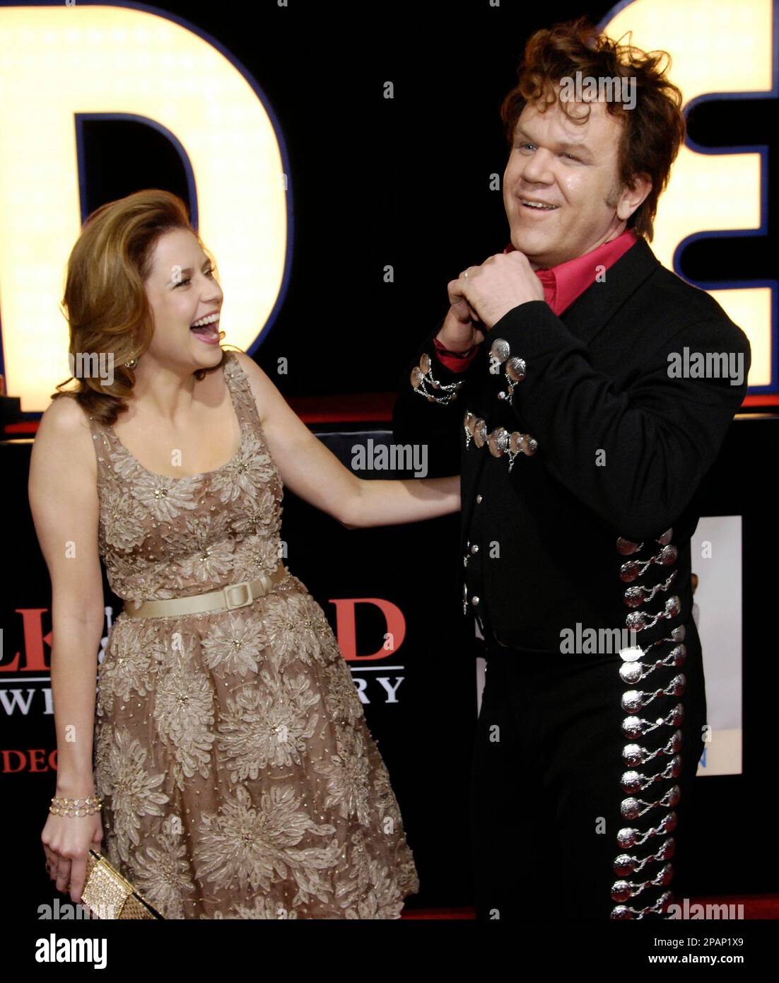 Actor John C. Reilly, who plays musician Dewey Cox in "Walk Hard: The Dewey  Cox Story," shares a laugh with fellow cast member Jenna Fischer at the  premiere of the film in