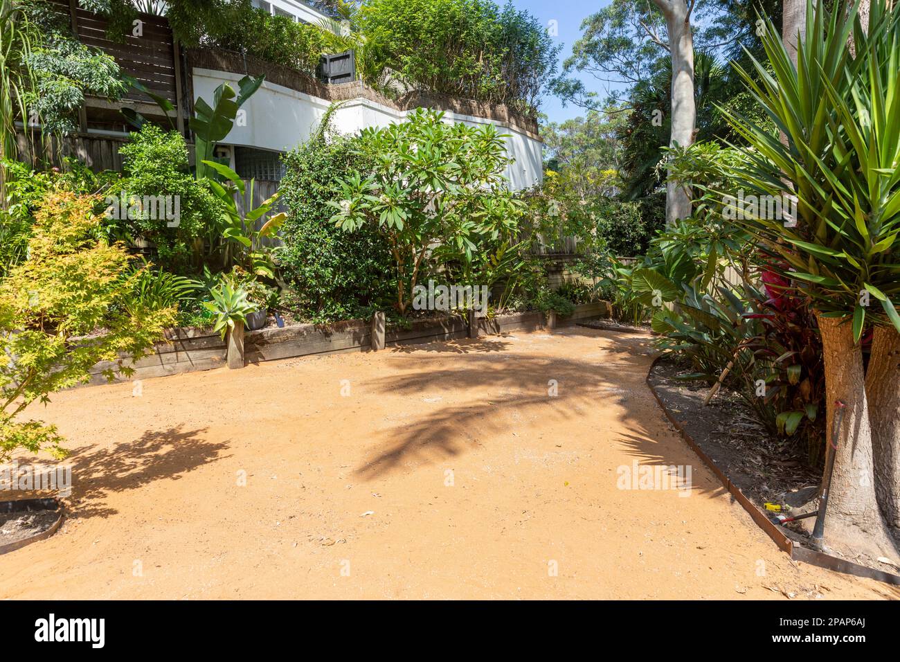 Sydney garden ready to receive new turf lawn, sand soil turf underlay on the ground ahead of