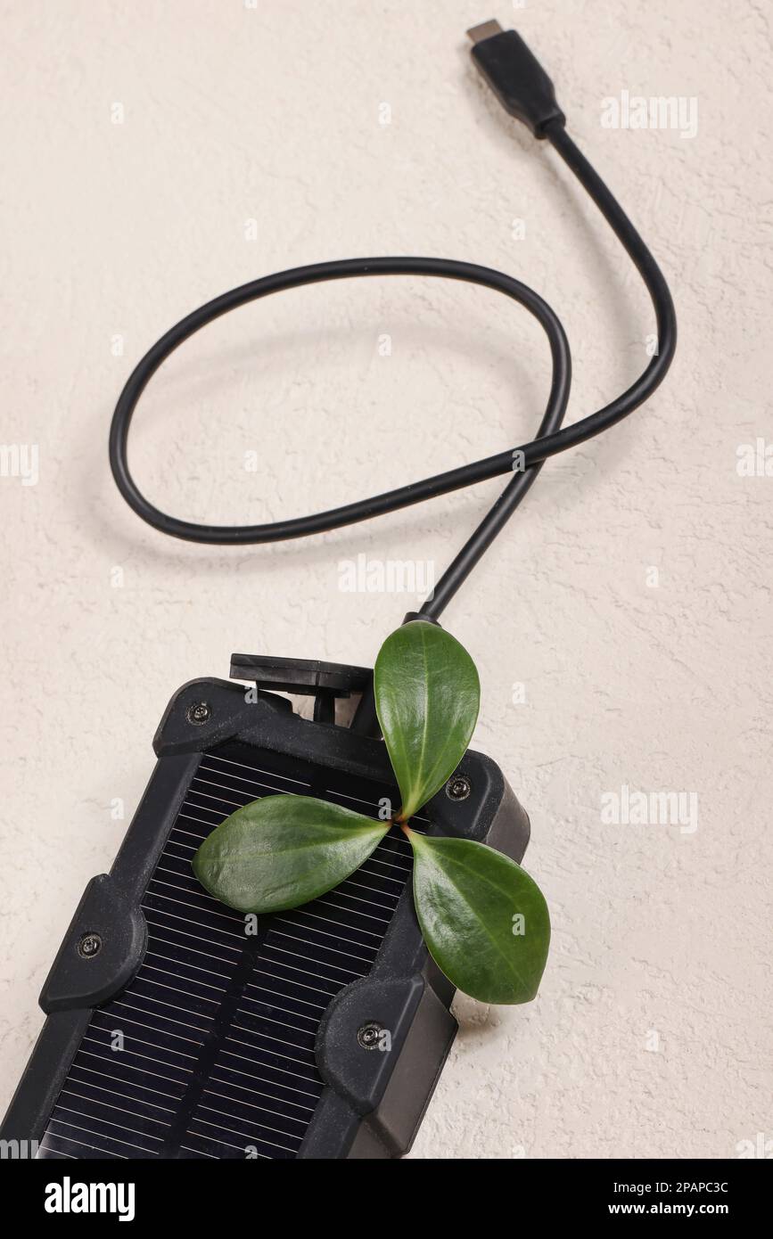 cheapest source of electricity. power box, portable solar battery for phone on white background. innovative solutions concept. copy space  Stock Photo