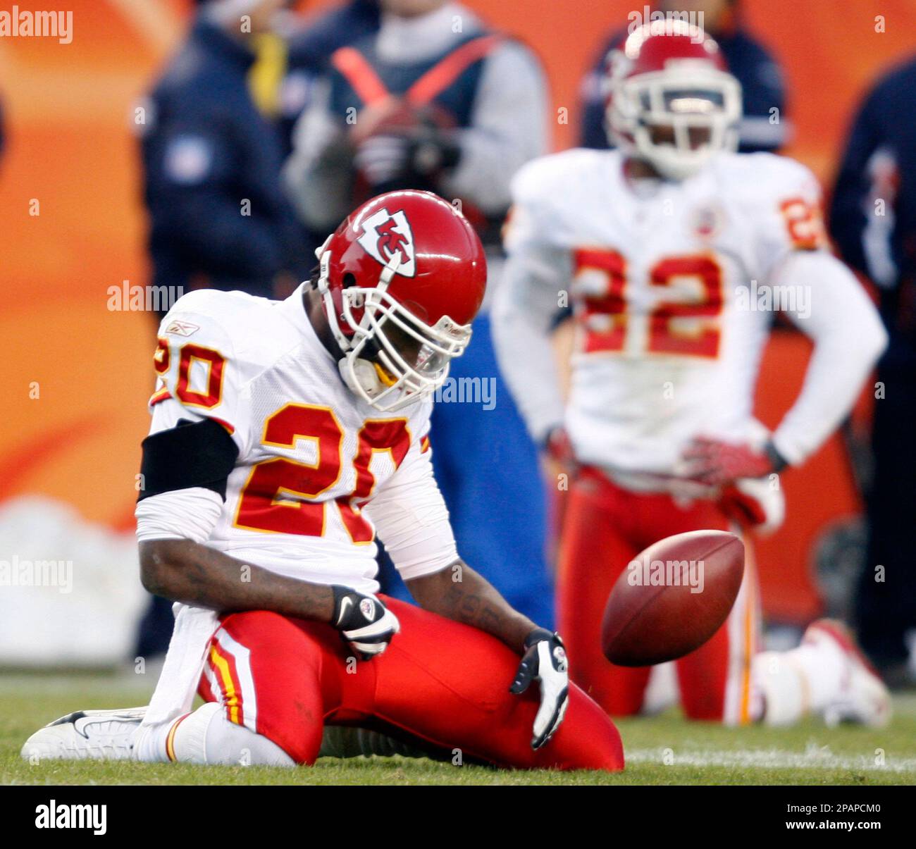 Kansas City Chiefs kick returner Benny Sapp, front, flips the ball away ...