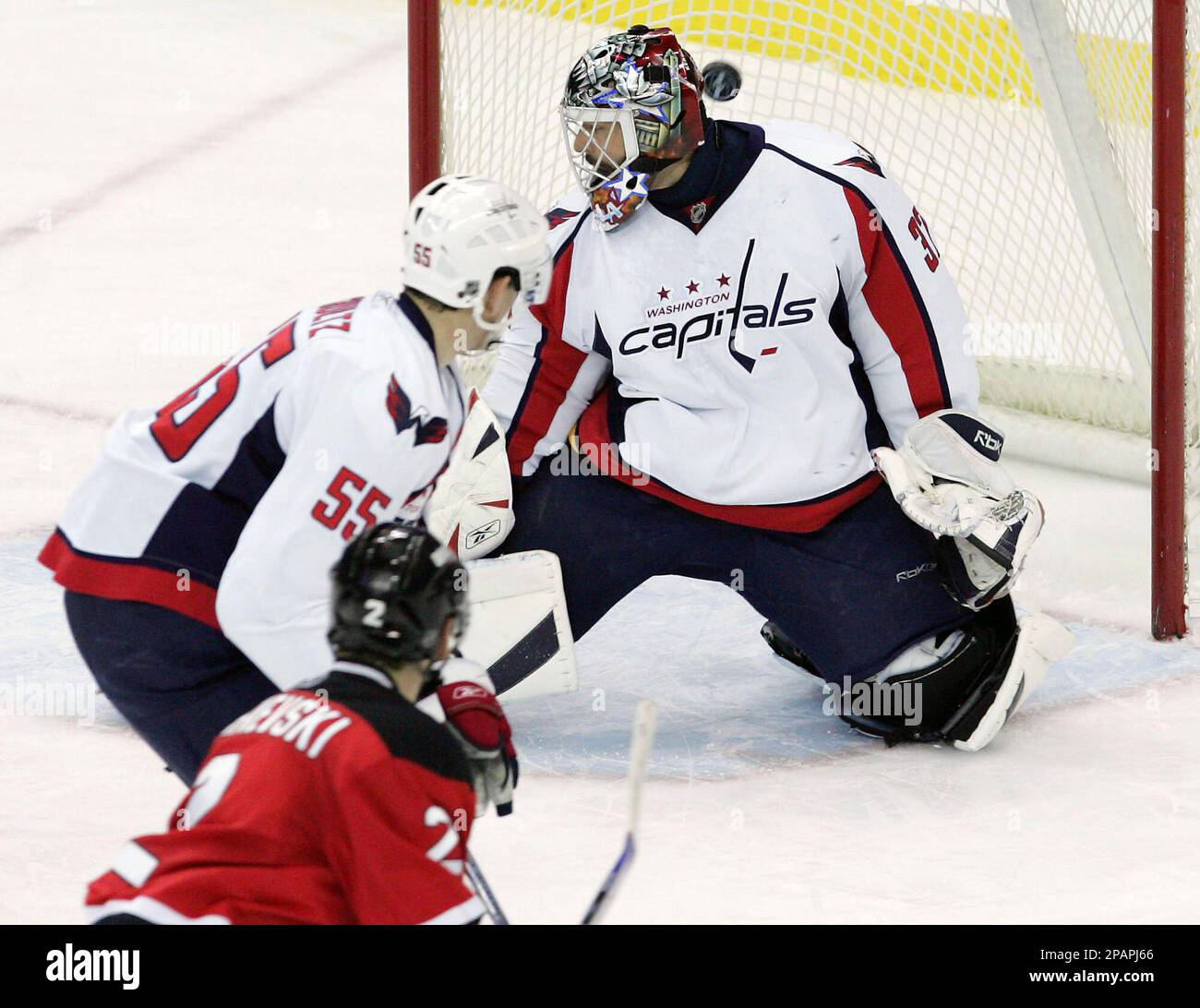 Buffalo Sabres' Patrick Kaleta, right, falls over New Jersey Devils' Vitaly  Vishnevski, of Ukraine, and goaltender Martin Brodeur, left, during the  third period of NHL hockey Tuesday, Jan. 8, 2008 at the