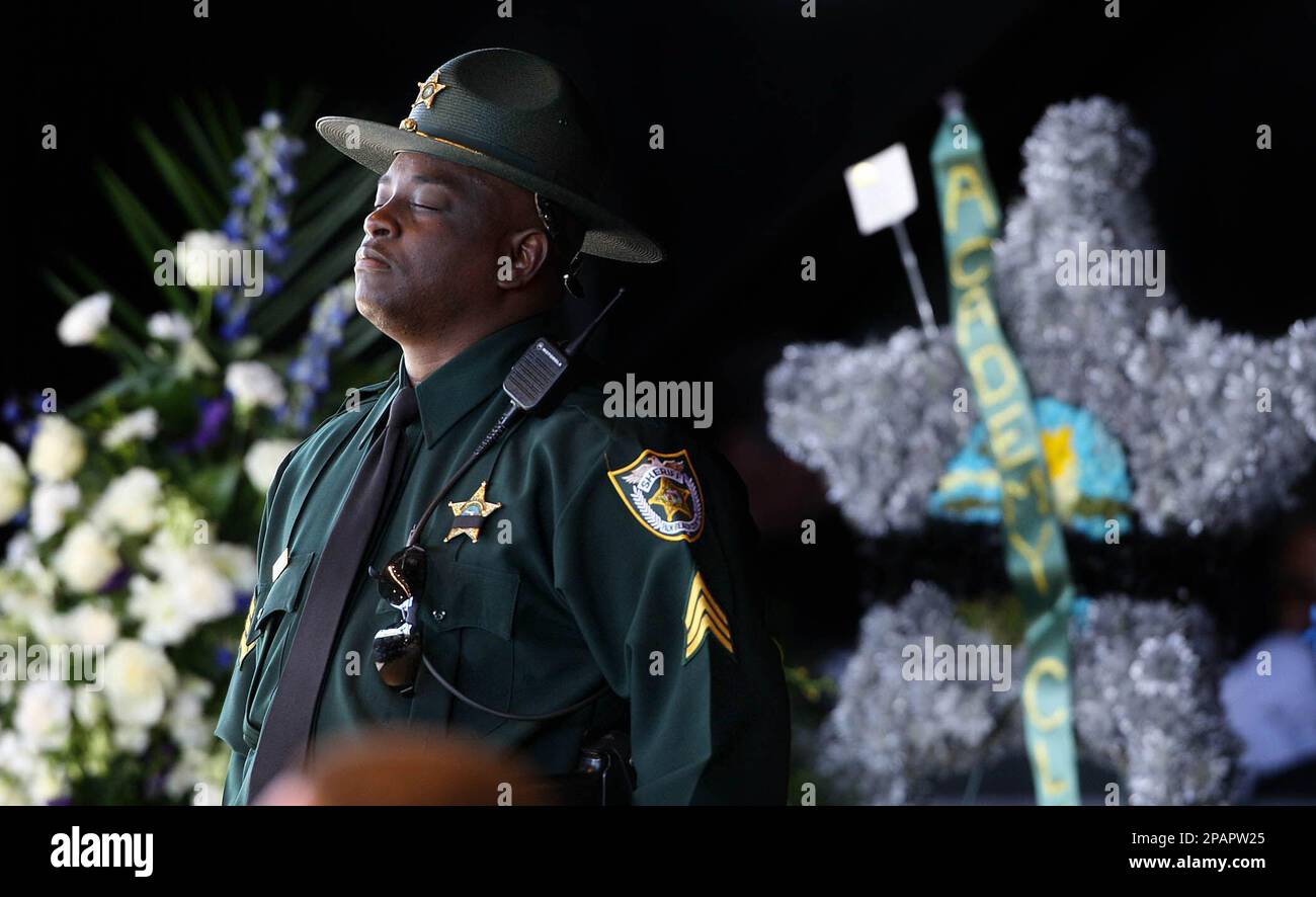 Sgt. Derek Savage, of the Palm Beach County Sheriff's Office, closes ...