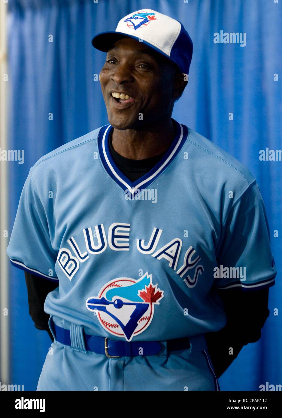 Former Toronto Blue Jays player Lloyd Moseby smiles as he models the team's  new uniform during a uniform launch in Toronto, Monday, Dec. 3, 2007. The  vintage powder blue uniforms will be