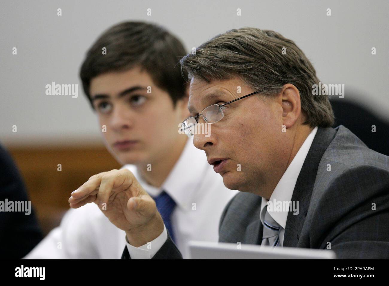 Defendant Jean Pierre Orlewicz, 17, of Plymouth Township, Mich. left,  listens as his attorney James C. Thomas speaks during a preliminary  examination, Friday, Nov. 30, 2007 in Plymouth, Mich. Canton High School