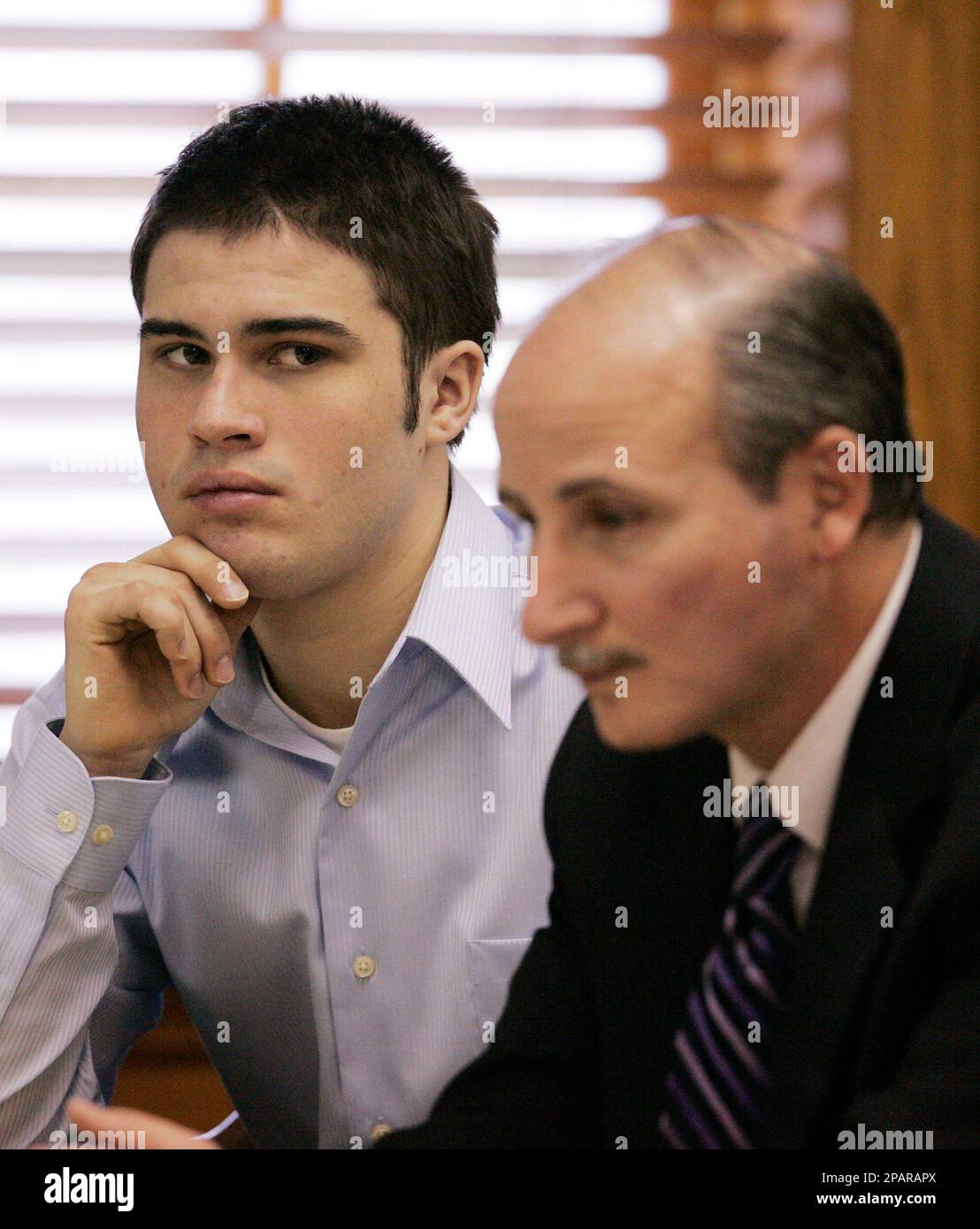 Defendant Jean Pierre Orlewicz, 17, of Plymouth Township, Mich. left,  listens as his attorney James C. Thomas speaks during a preliminary  examination, Friday, Nov. 30, 2007 in Plymouth, Mich. Canton High School