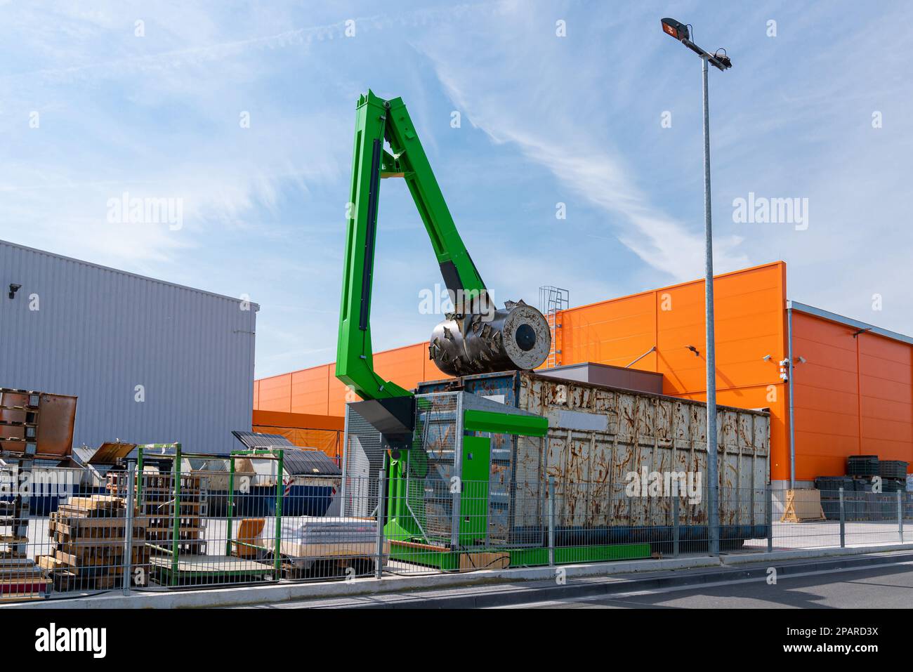 Waste garbage compactor working on a dumpster bin. Recycle machine