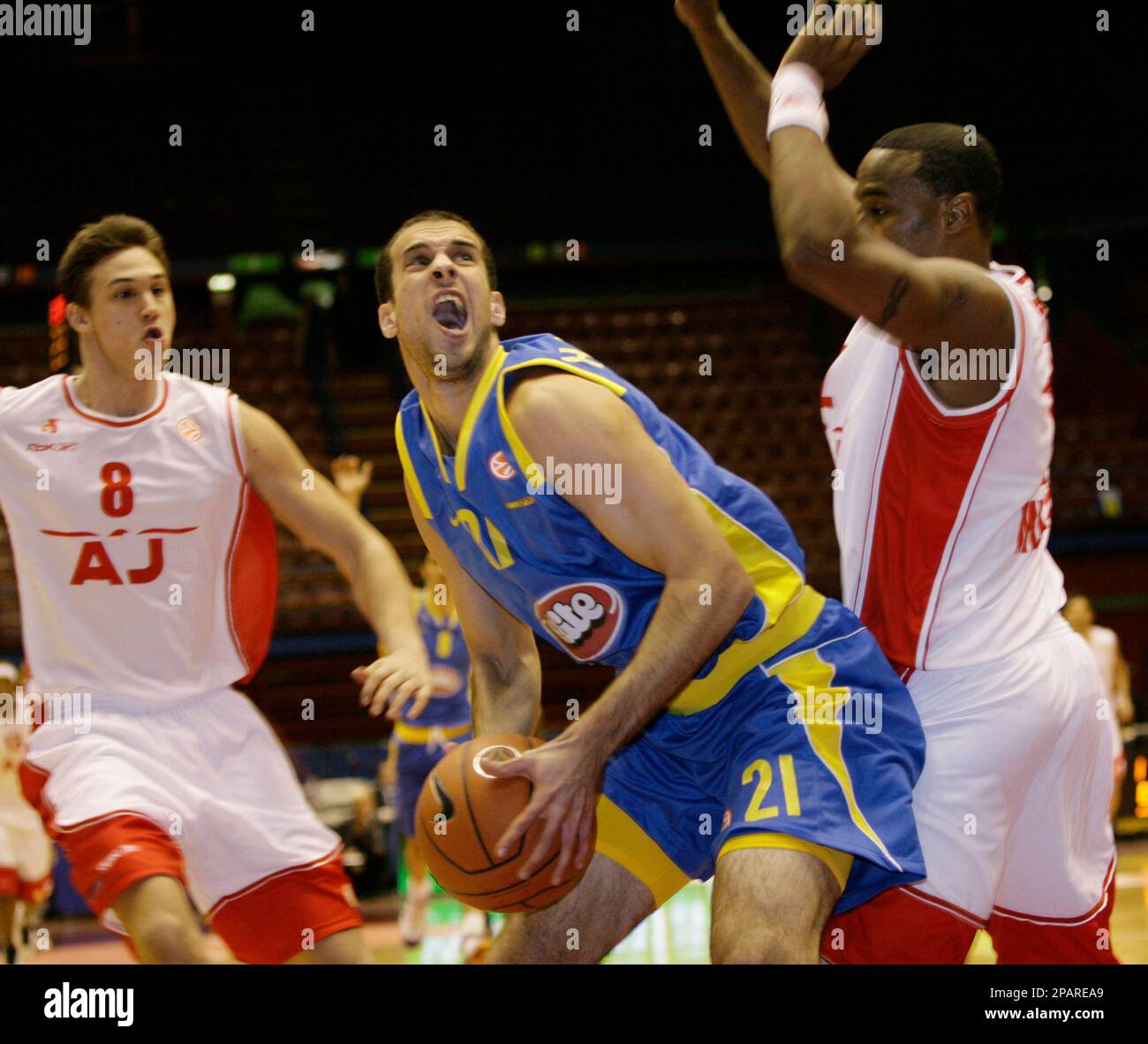 Maccabi Tel-Aviv guard Yotan Halperin, center, is pressed by Armani Jeans  forward Danilo Gallinari, left, and guard Davide Marelli, during a  EuroLeague, Group B basketball game, at the Forum, in Assago, near