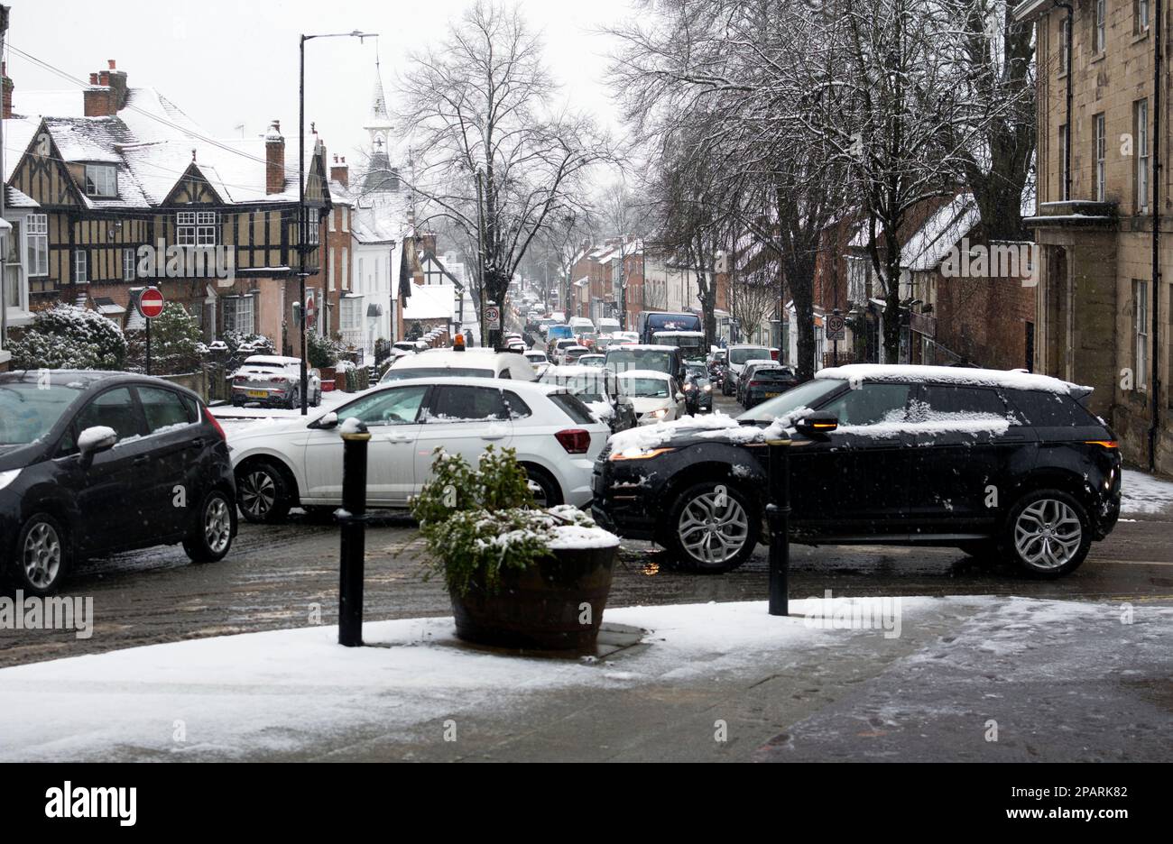 Traffic congestion in snowy weather, Warwick, Warwickshire, UK Stock Photo