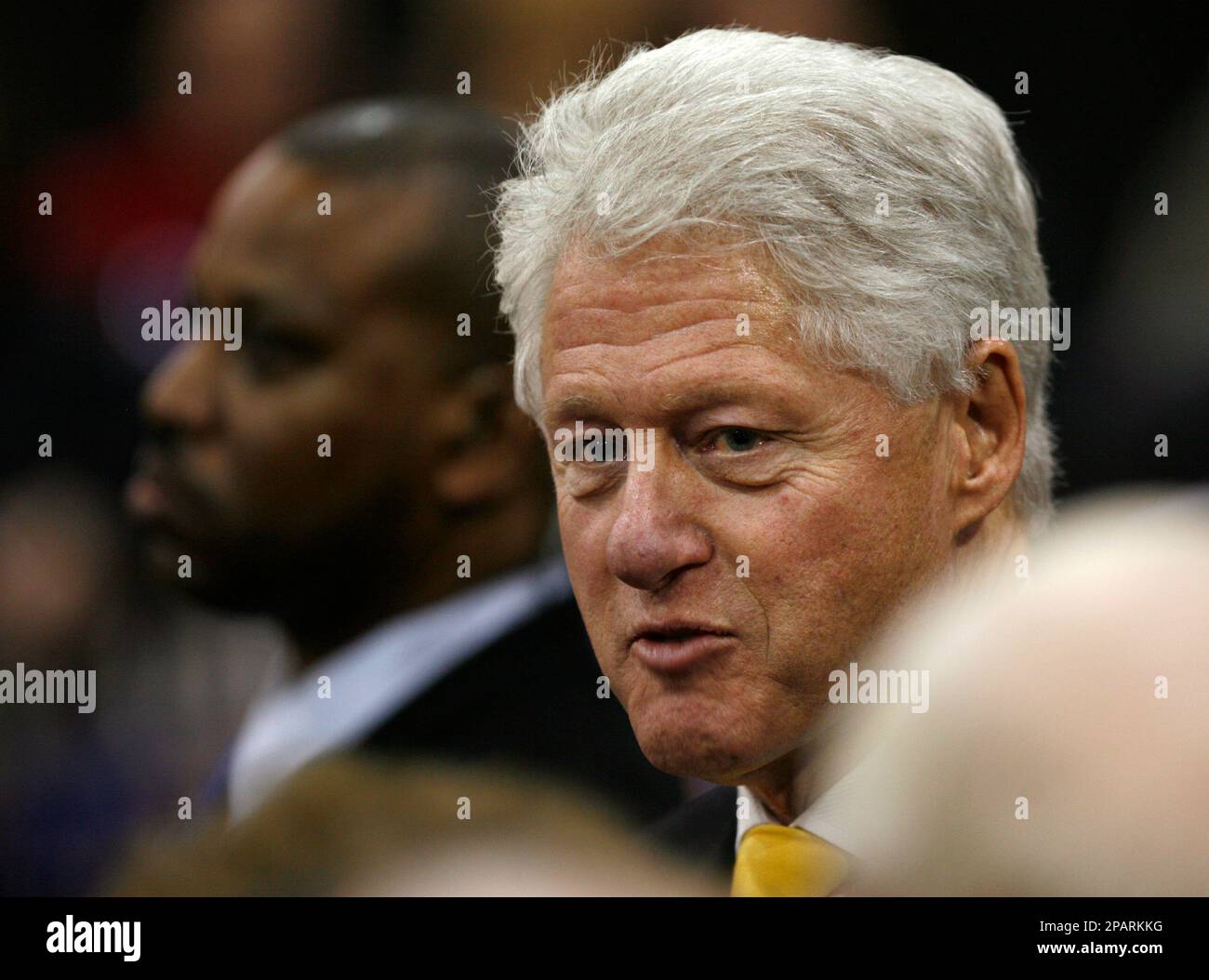 Former president Bill Clinton speaks to local residents during a