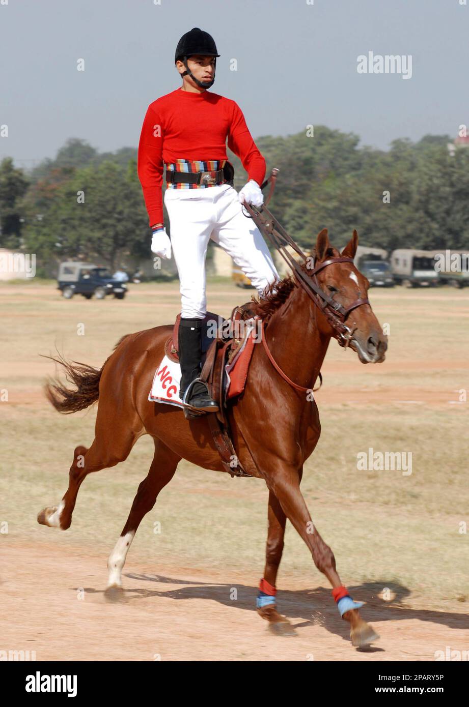 A cadet of the National Cadet Corps (NCC) displays horse riding skills ...